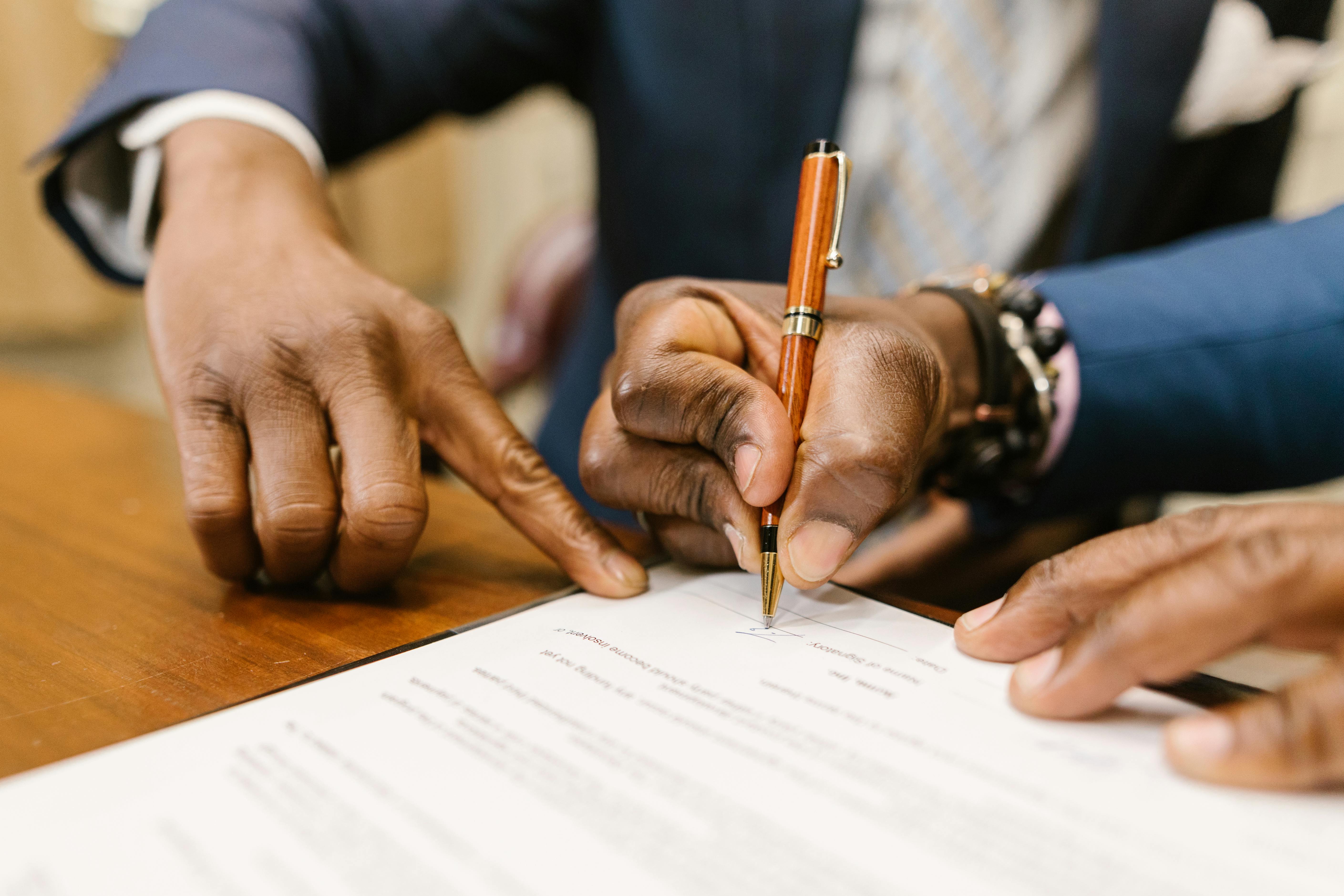 Man signing a loan contract