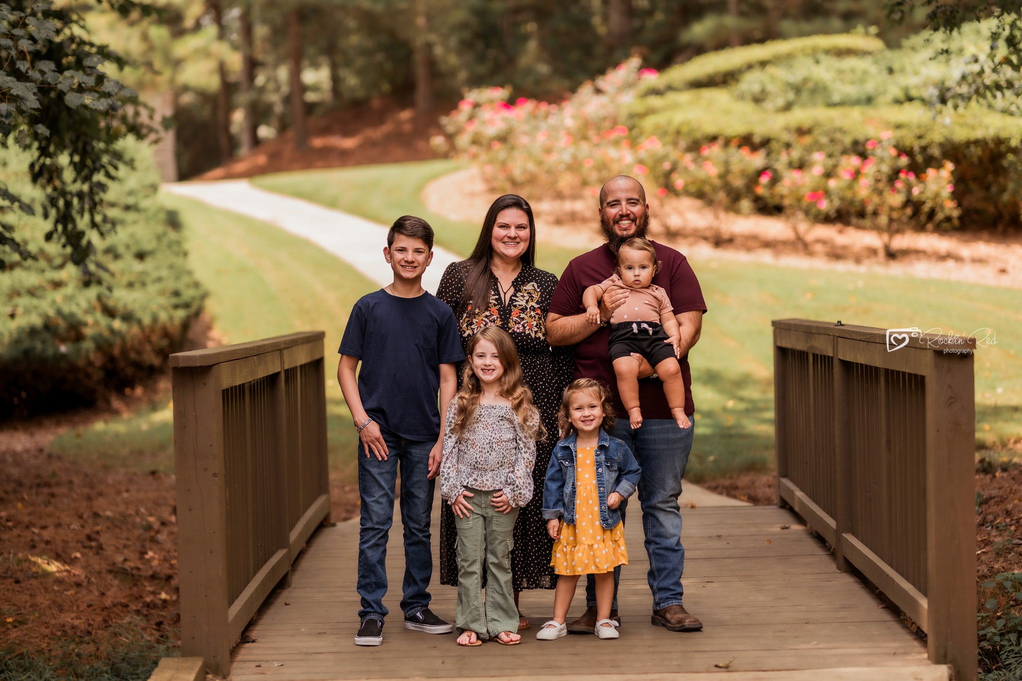 Family photo standing on bridge