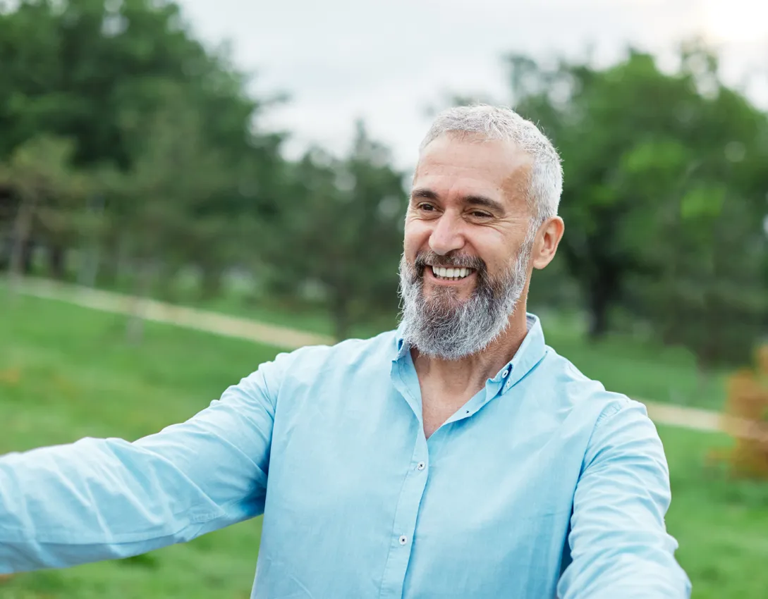 happy bearded man in blue shirt