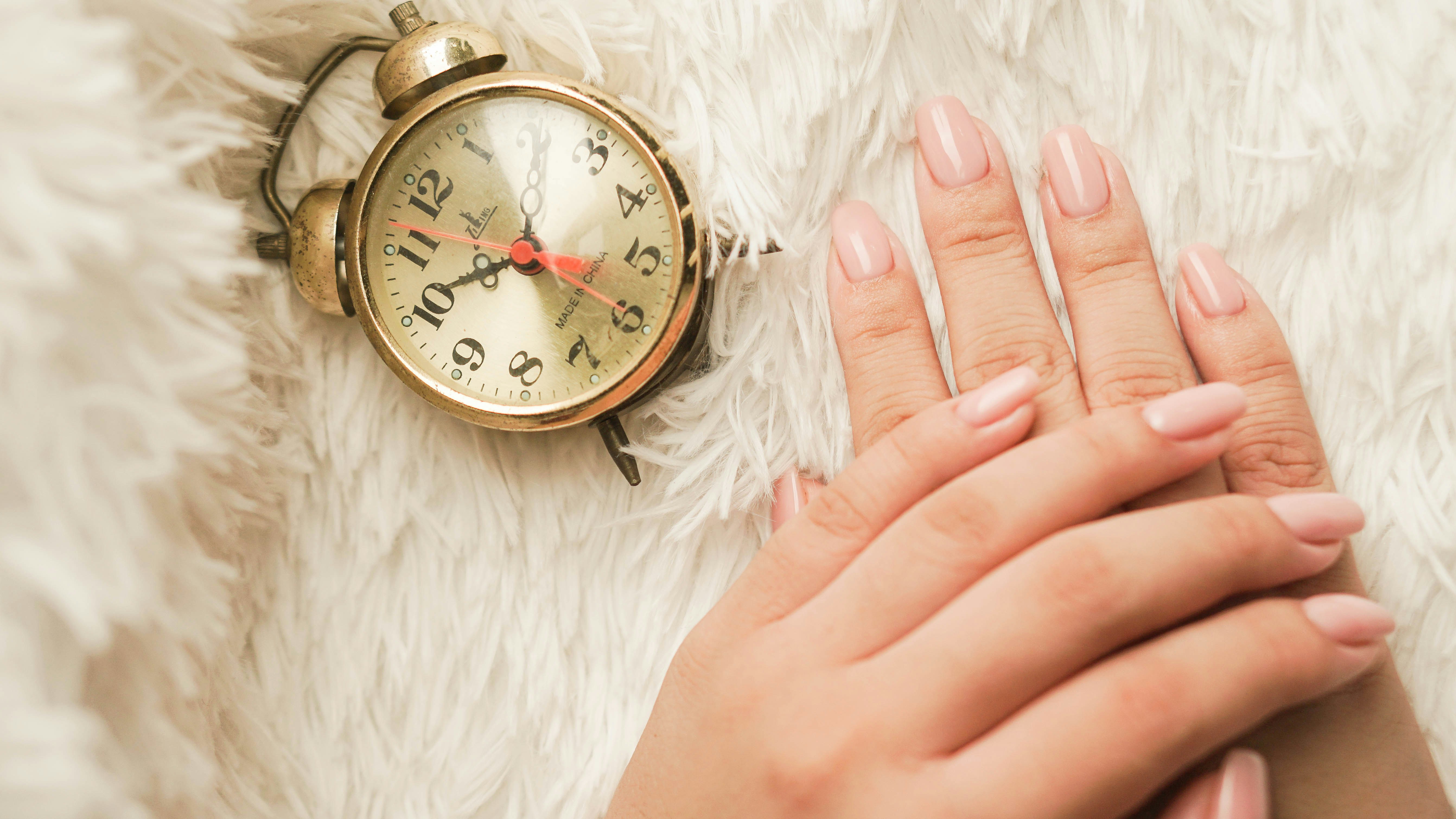 Woman Hands with a Clock - Best Colors for Light Brown Skin