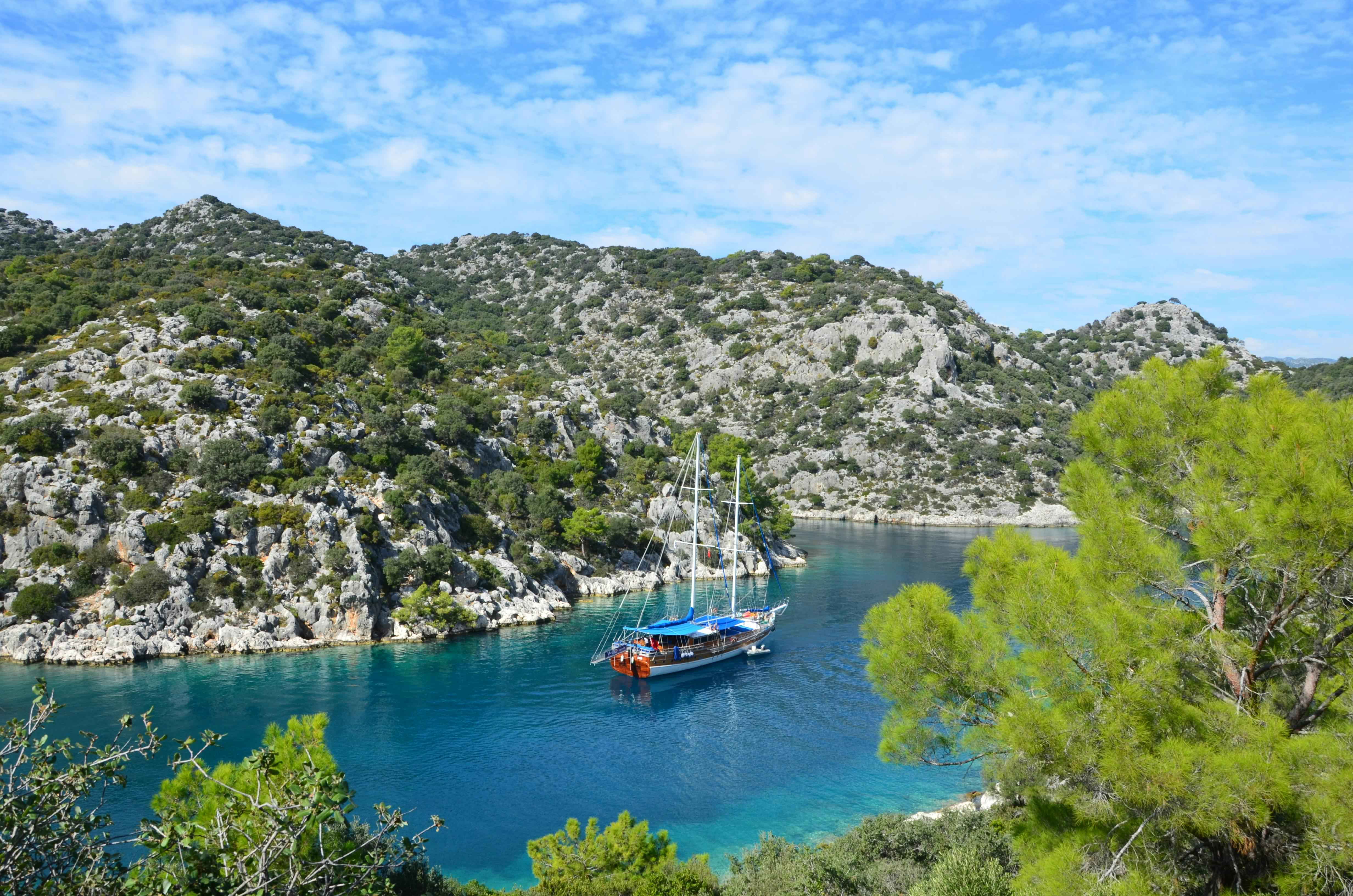 Commercial charter yacht operating along the Fethiye coastline under Turkish maritime regulations