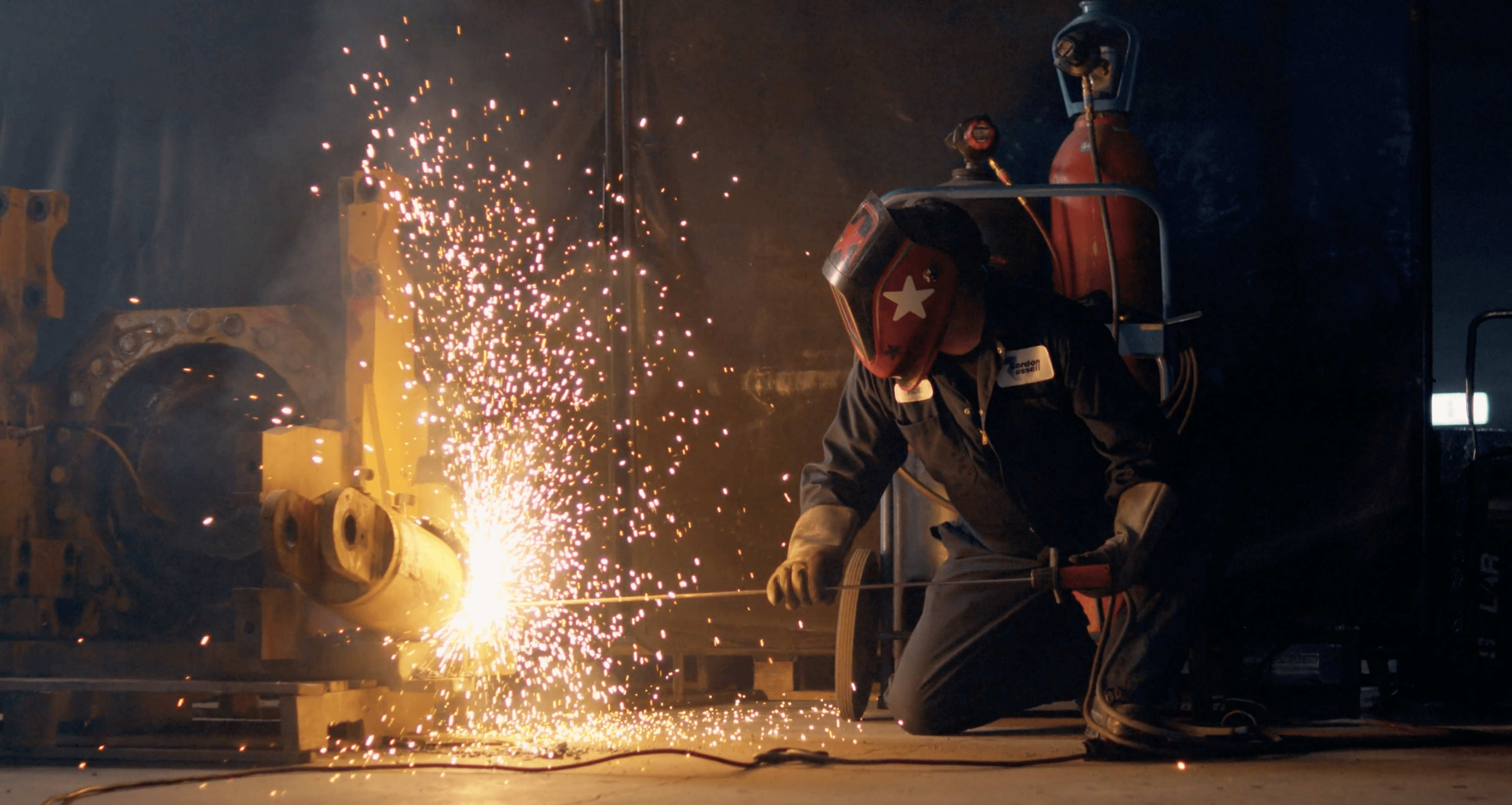 Hands working on a device or document, representing professional results delivered to clients.