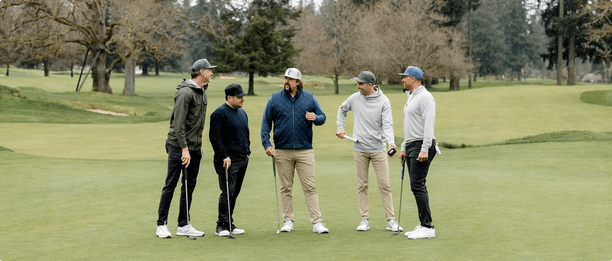 Lifestyle image of golfers wearing True Linkswear footwear on a golf course