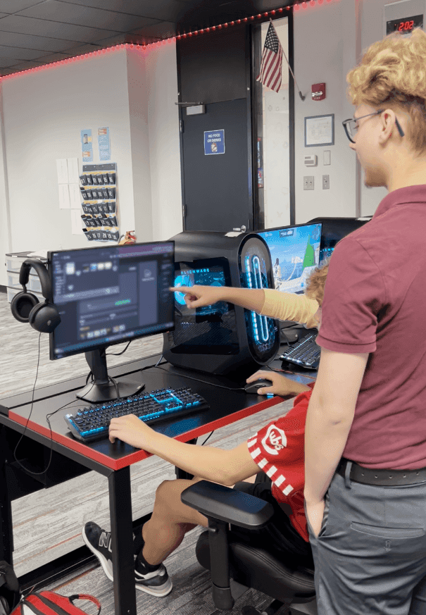 Justin and a student uses gameplan in the computer room