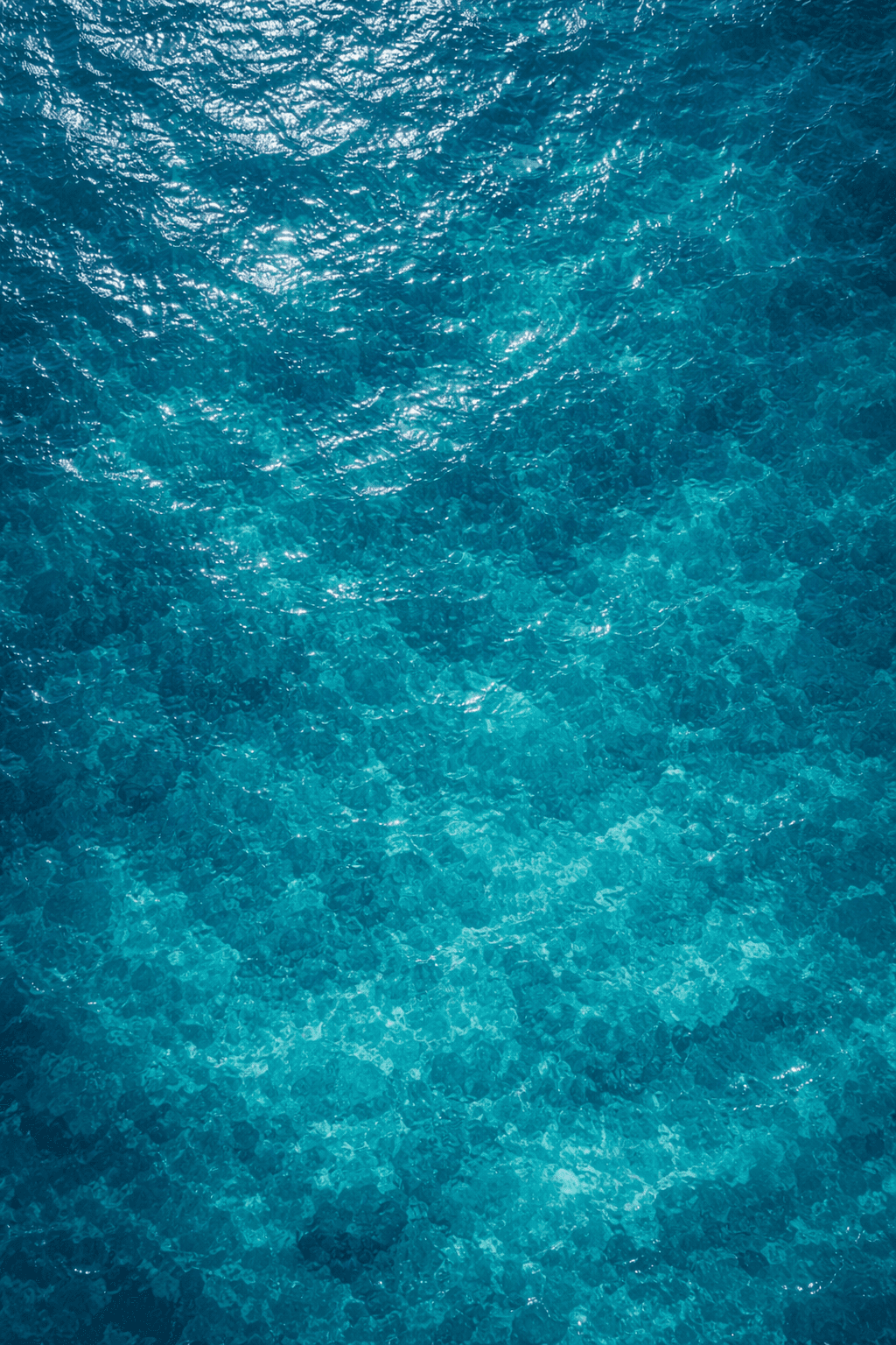 aerial view of village on mountain cliff during orange sunset