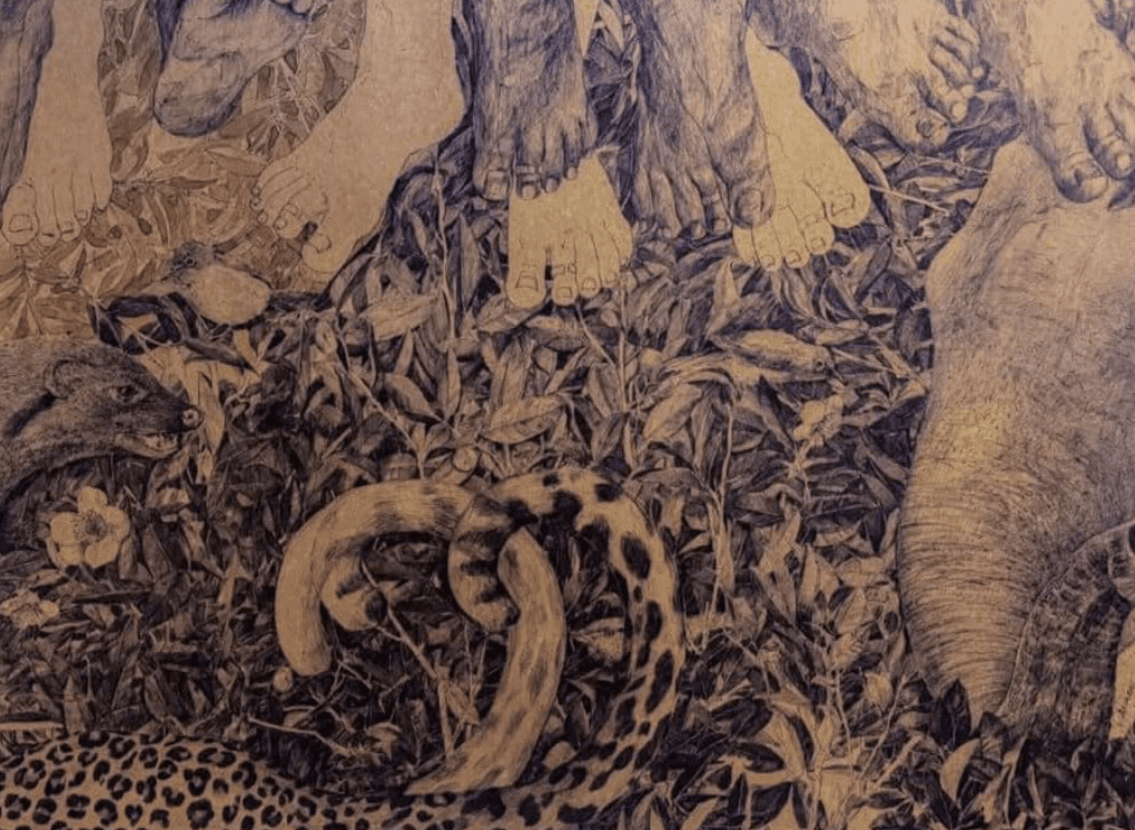 A man playing a drum in front of a group of people