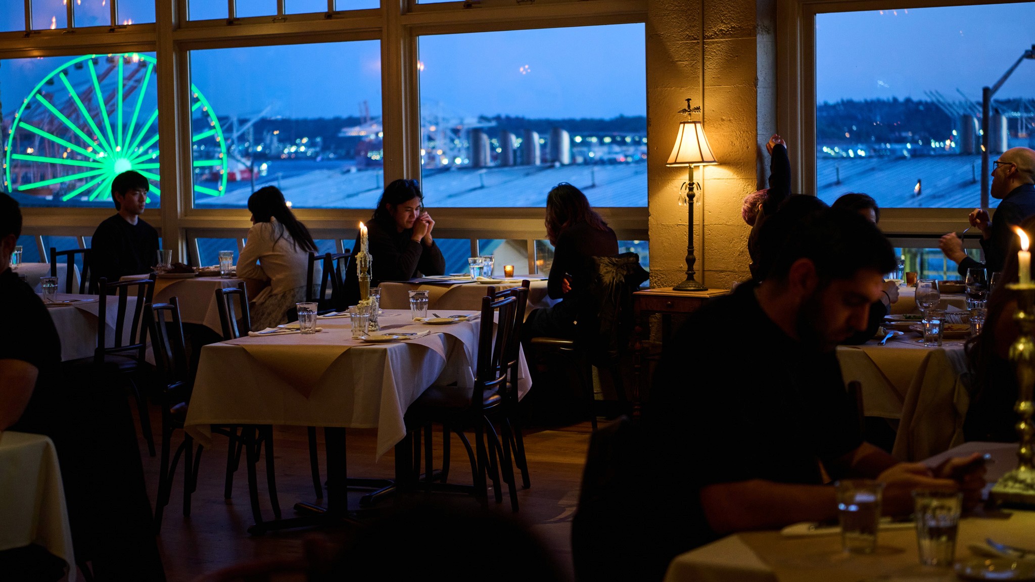 Customers dining with the Ferris Wheel in background