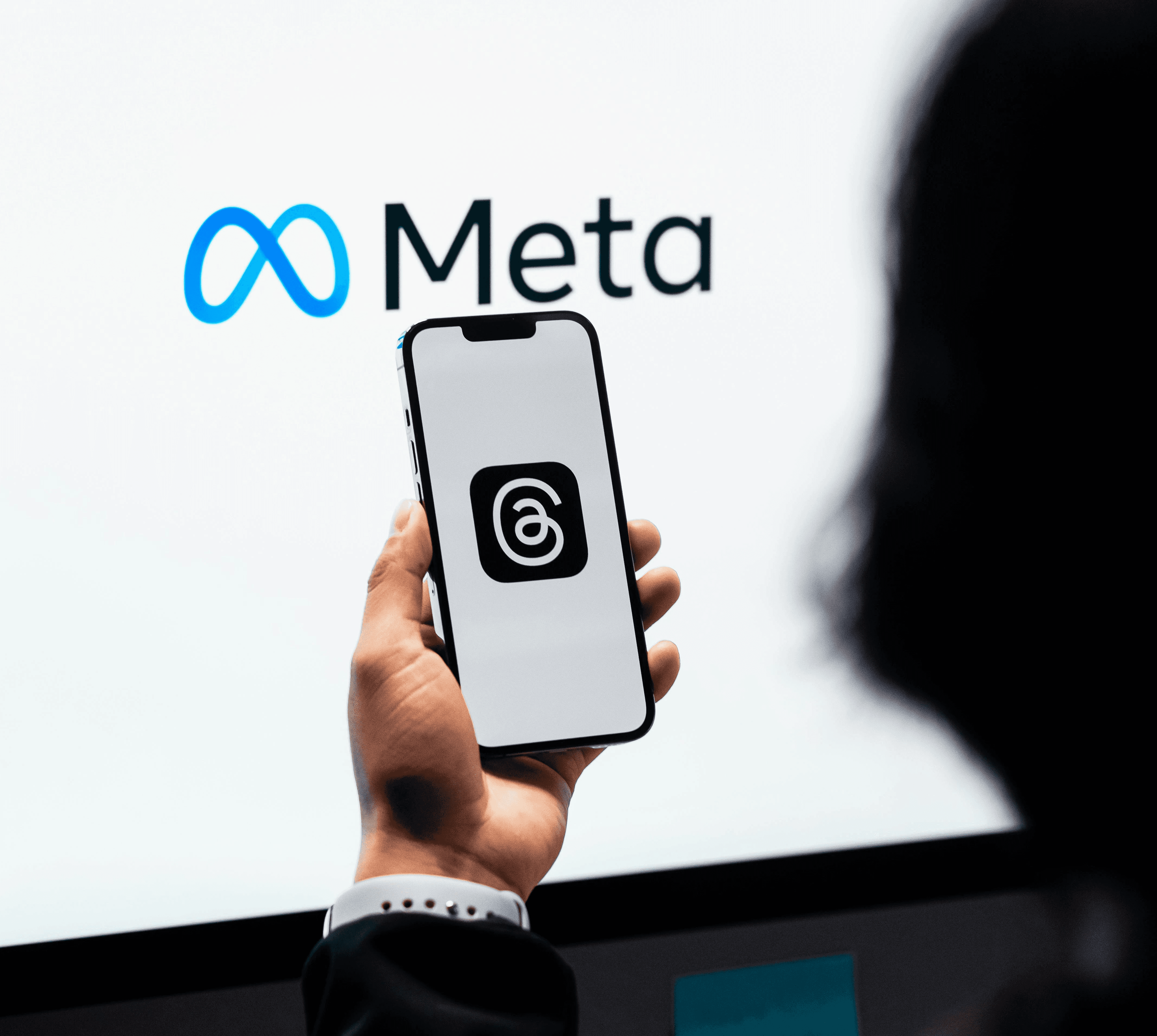 person sitting in a chair in front of a man