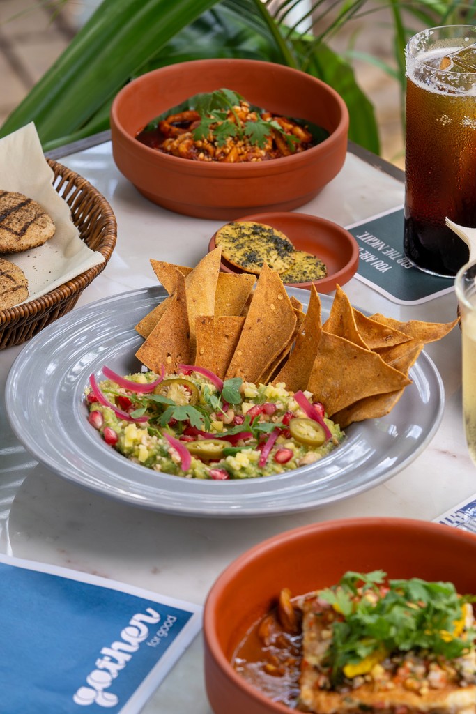 Food spread by Gather featuring a coaster designed by Rare Ideas.