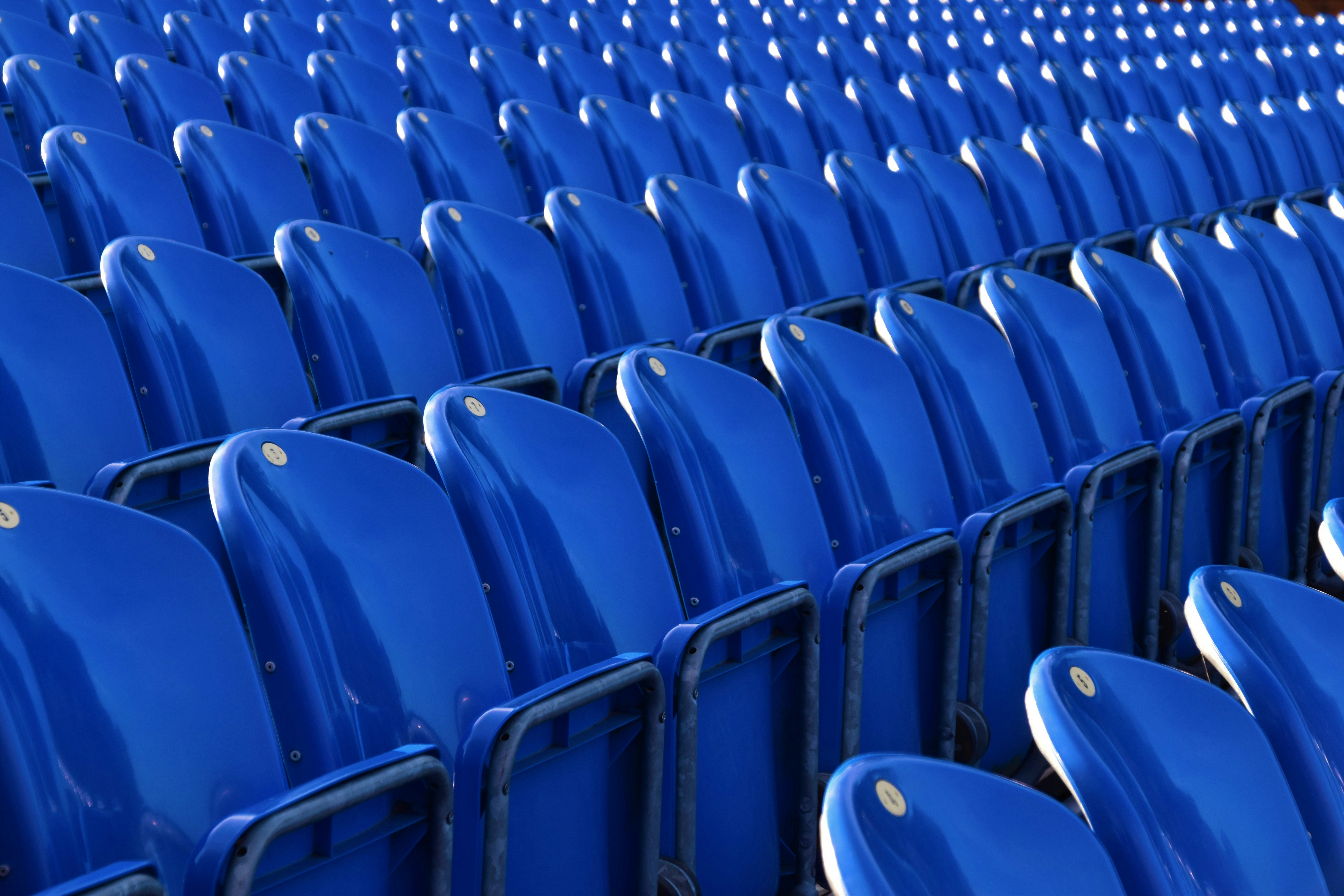 sports grandstand with blue chairs