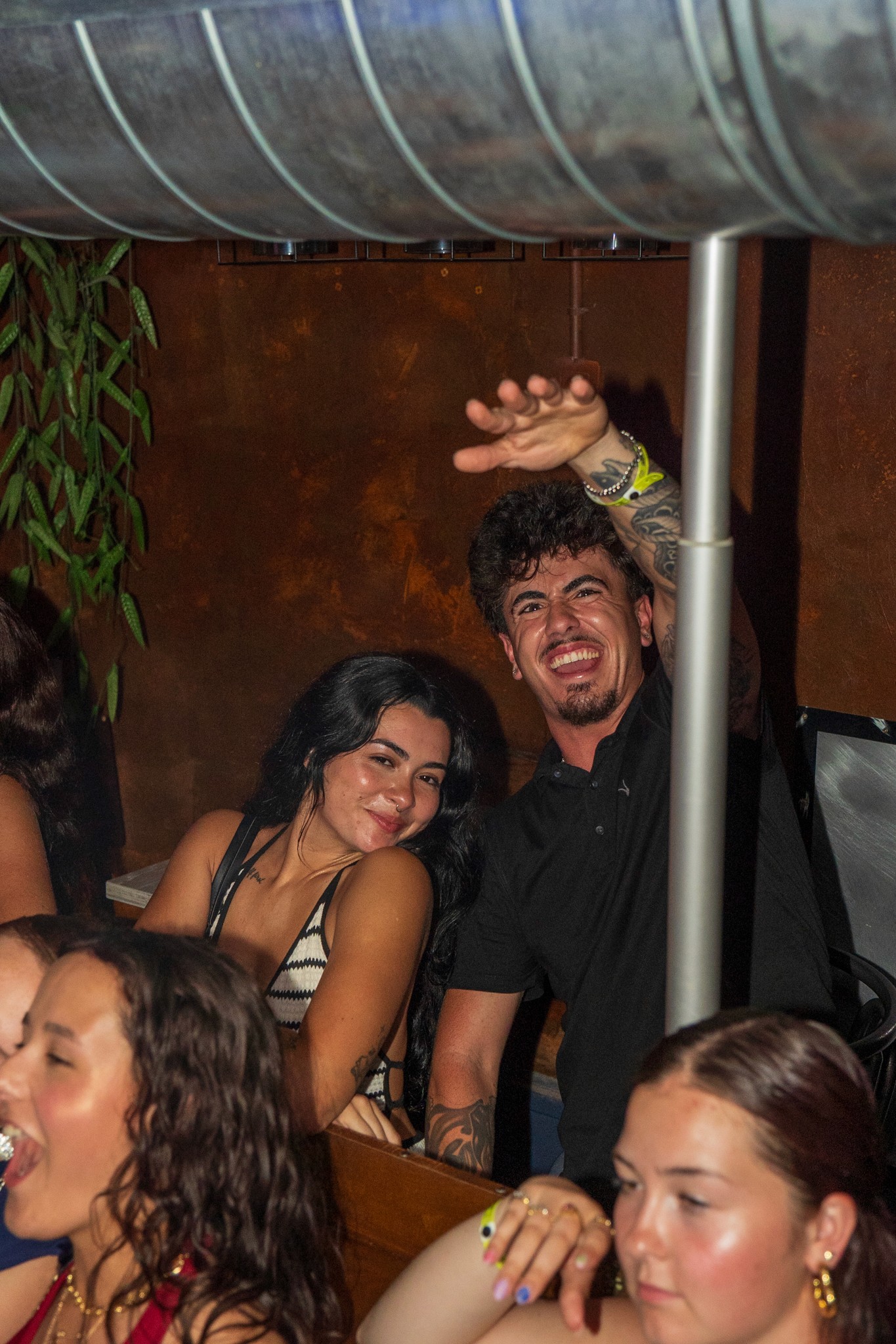Young partygoers enjoying the moment inside a crowded bar during a bar crawl in Nice capturing spontaneous fun loud energy and the carefree party atmosphere of a high intensity nightlife experience on the French Riviera