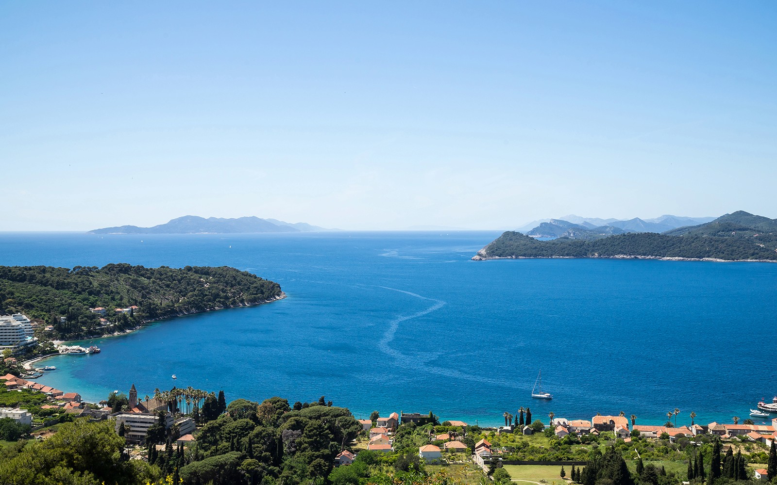 Dubrovnik Elaphites cruise view with islands and sailboats in the Adriatic Sea.