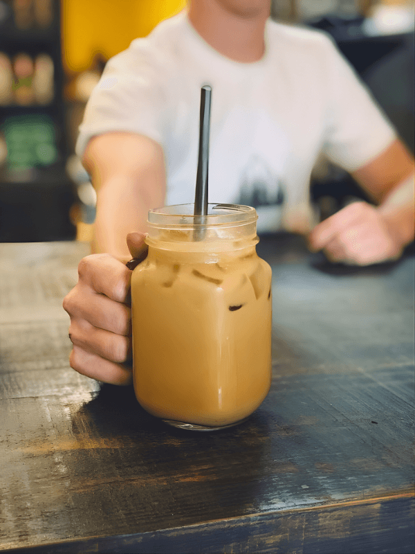 Person uses portable ssd with smartphone outdoors