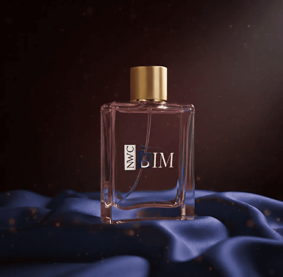 Elegant perfume bottle with a gold cap and the initials "SIM" on a blue satin cloth.