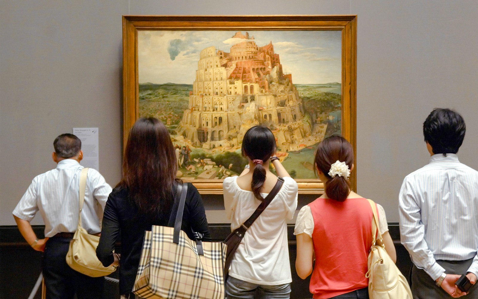 Visitors viewing Brueghel's Tower of Babel painting at Kunsthistorisches Museum.