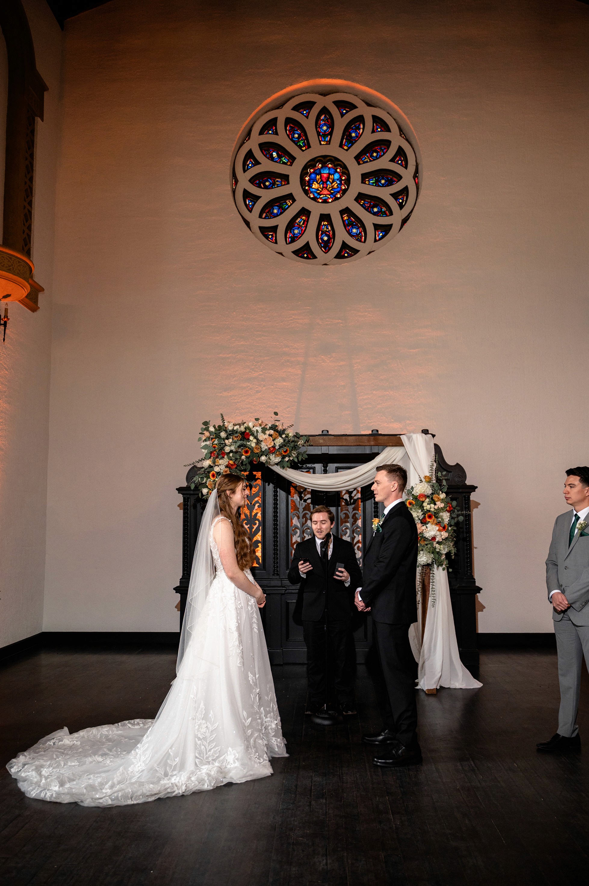 Flat lay wedding details with bouquet, rings, and sparkling bridal heels