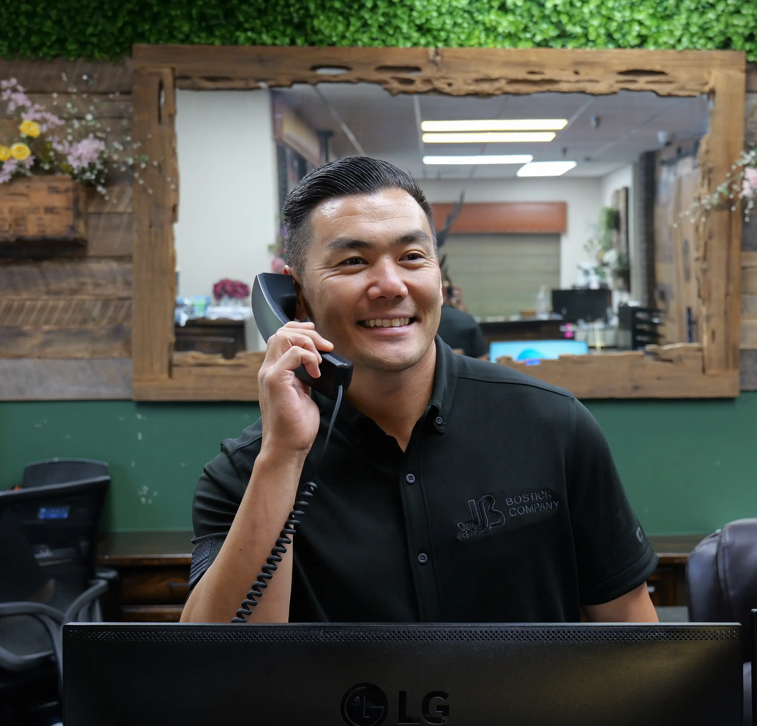 Man at desk talking on phone