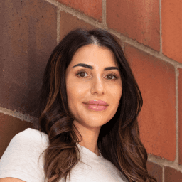 Possible member smiling and looking at the camera.