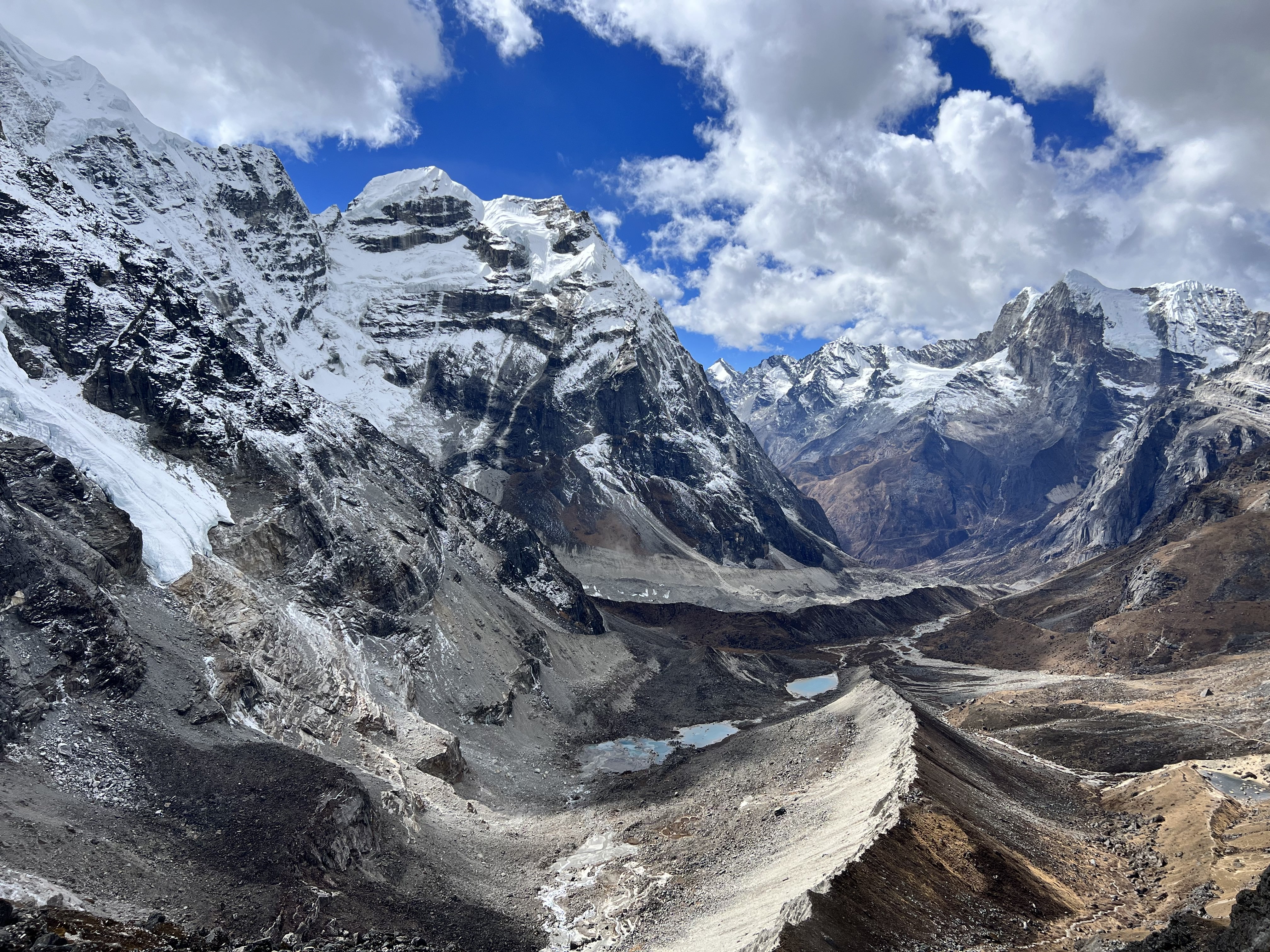 an aerial view of a mountain range at sunset