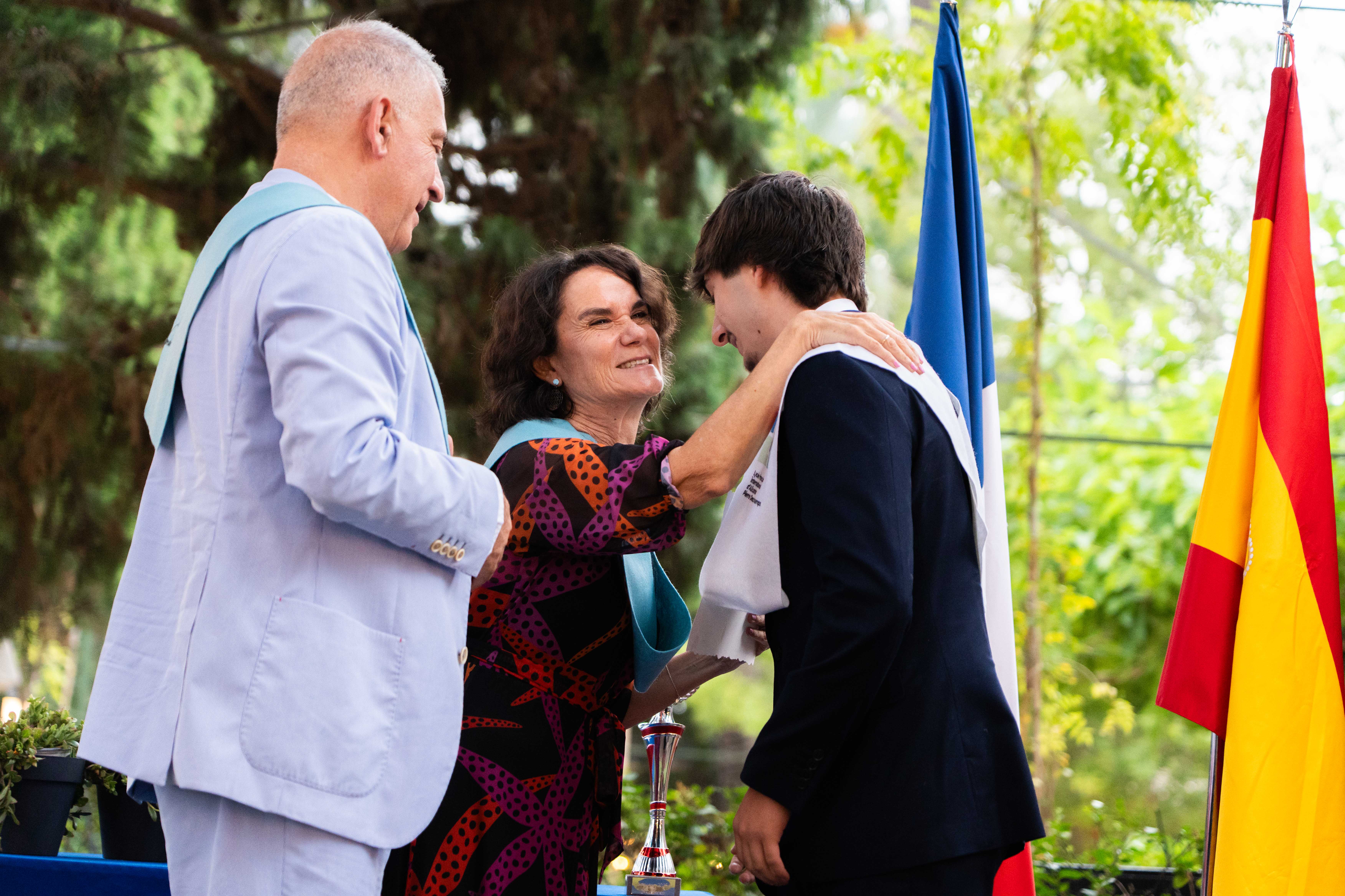  A woman in a helmet with a light trail, suggesting movement or speed in a dynamic outdoor setting.