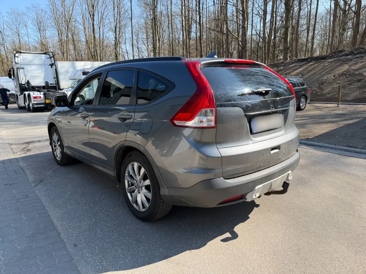 a grey honda car from the back