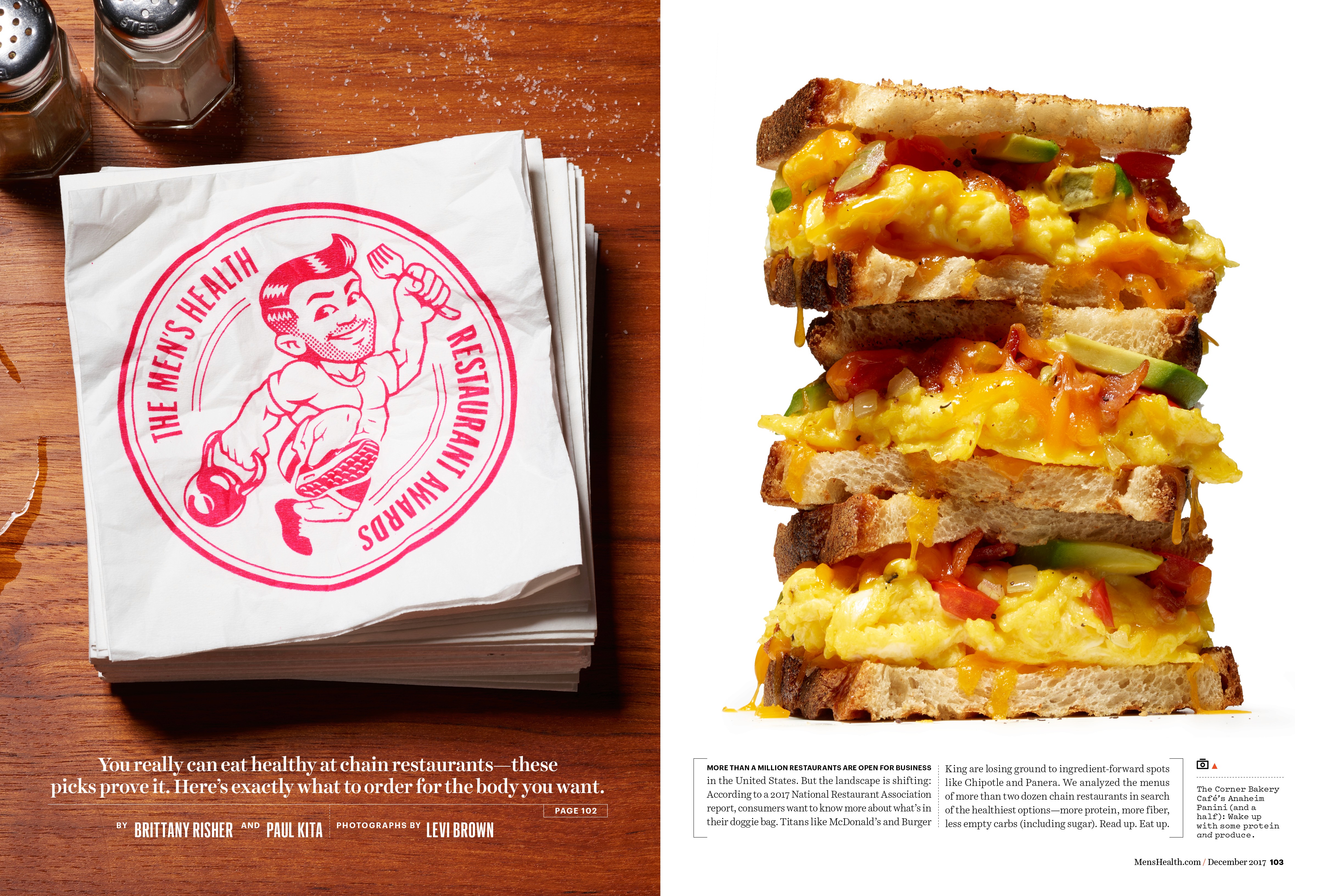 A spread layout features one side with a top-down view of a diner table, showcasing a stack of paper napkins. These napkins bear a whimsical illustration of a muscular man holding a fork and kettlebell. On the opposite page, there's a stack of sandwiches made with egg, bacon, and avocado, each cut in half.