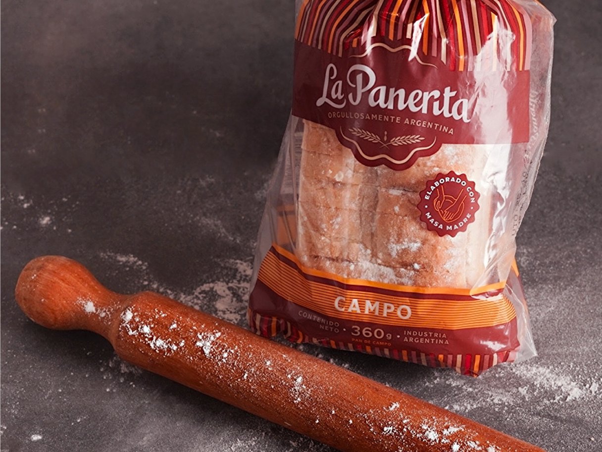 Rooftops of a coastal town with the sea in background