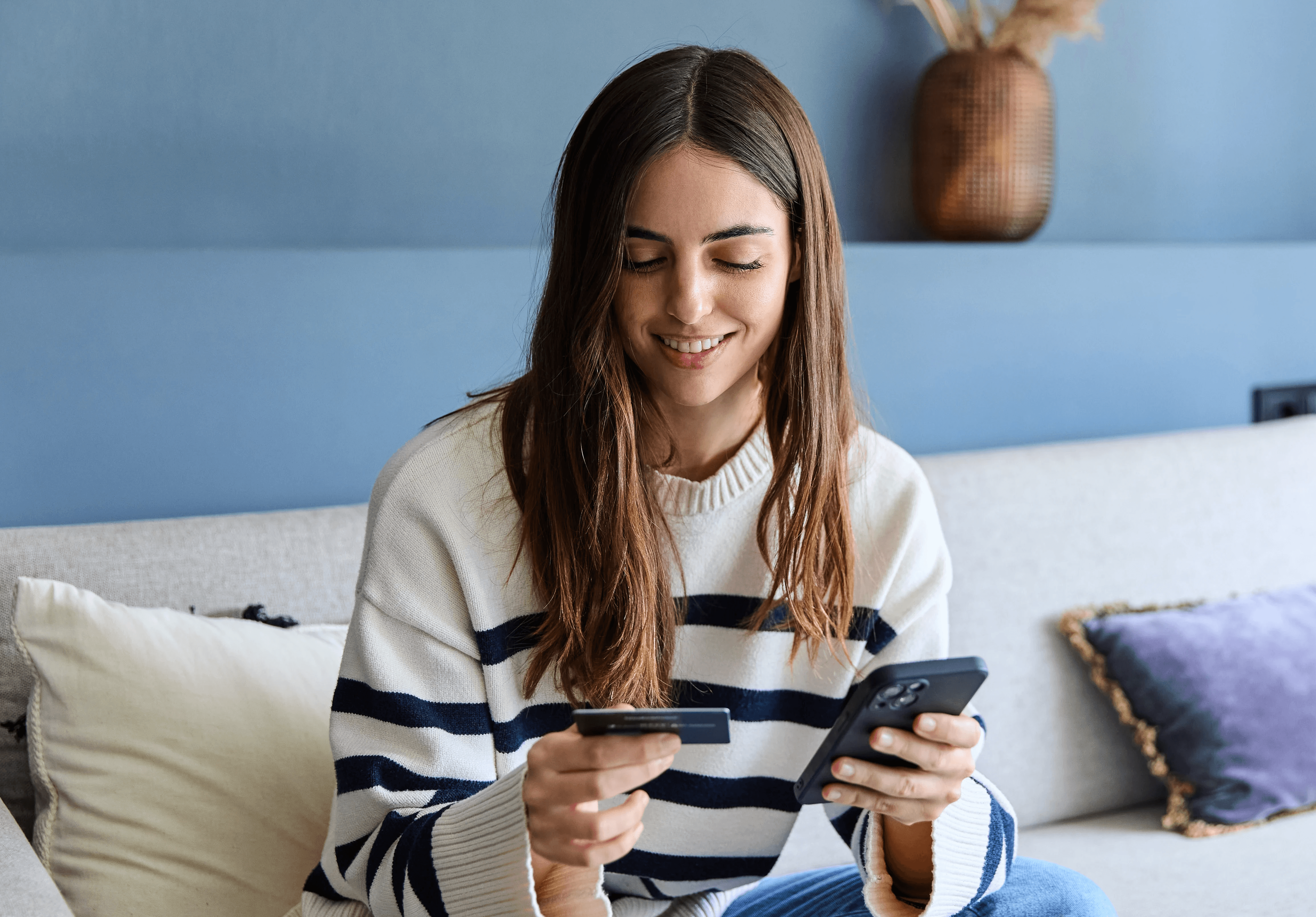 Person smiling while working on a laptop, with icons representing AI-powered research tools around