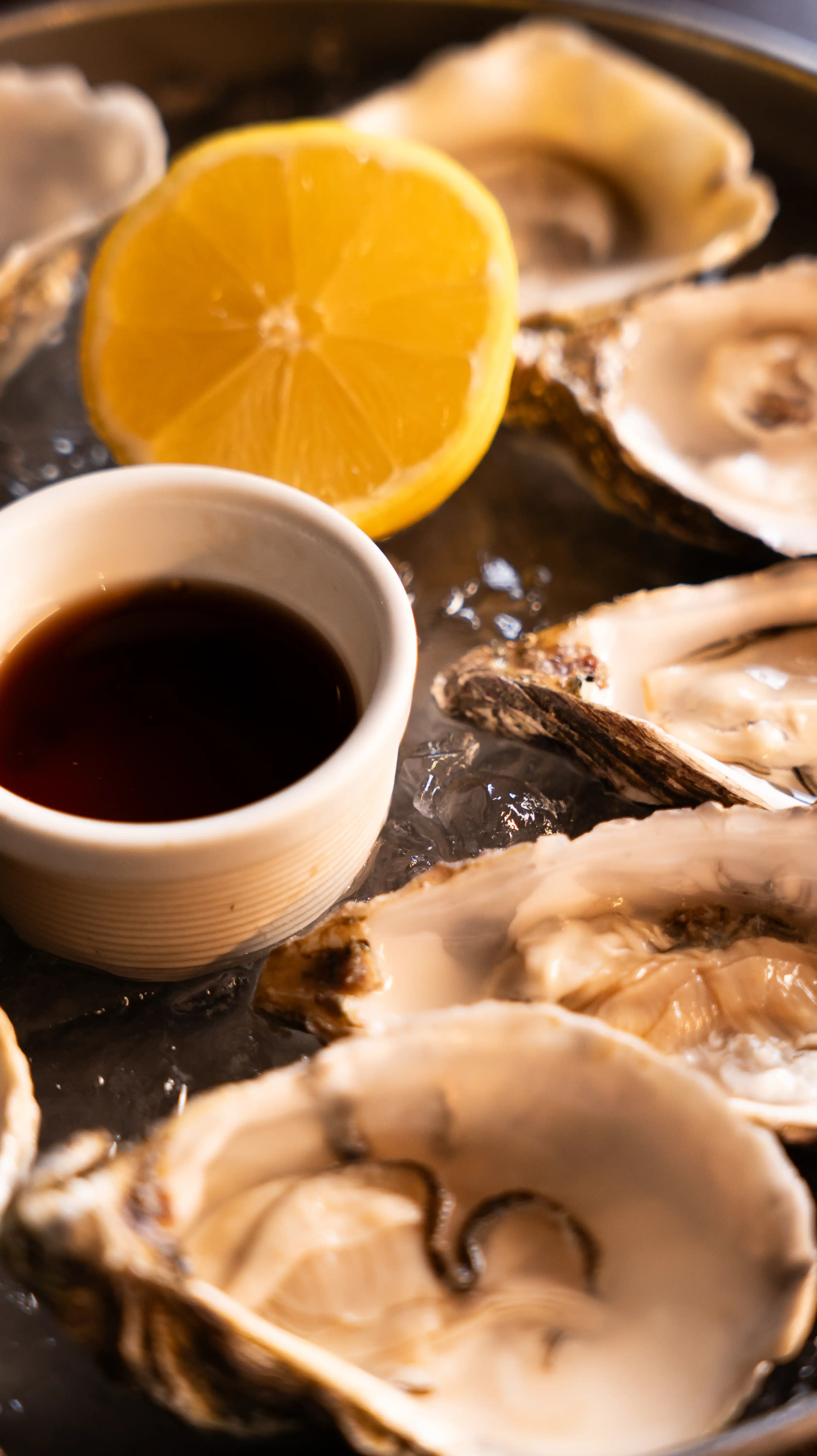 Bowls of oysters and a lemon at The Gun pub in London