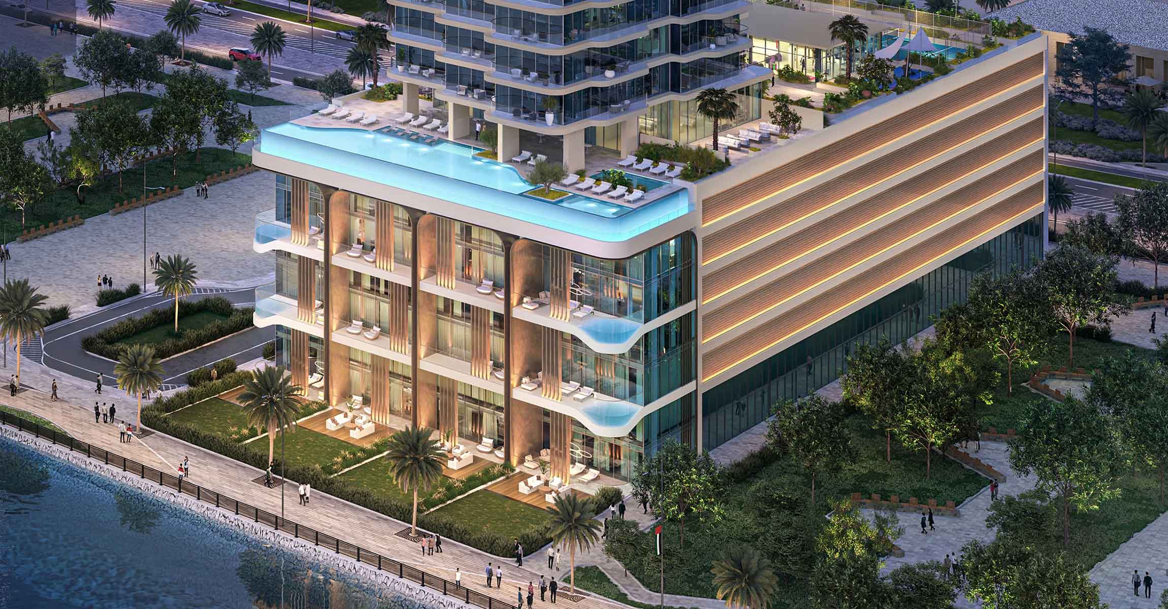 Aerial view of LIV Oceanside, showcasing a modern building with a large pool surrounded by landscaped areas.