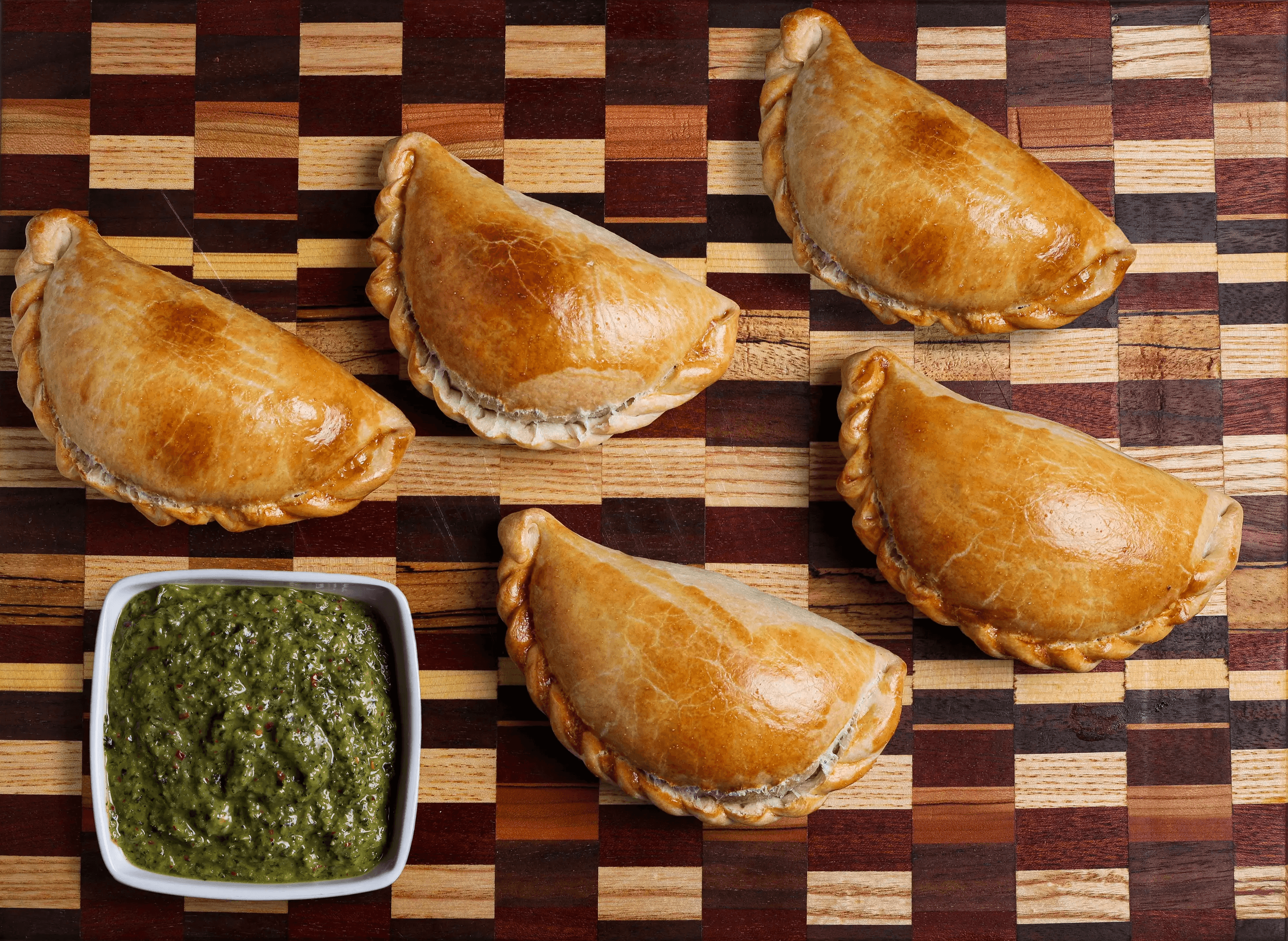 Golden baked artisan empanadas hand-crafted by Chef Marcelo Anastasi Vancouver Island