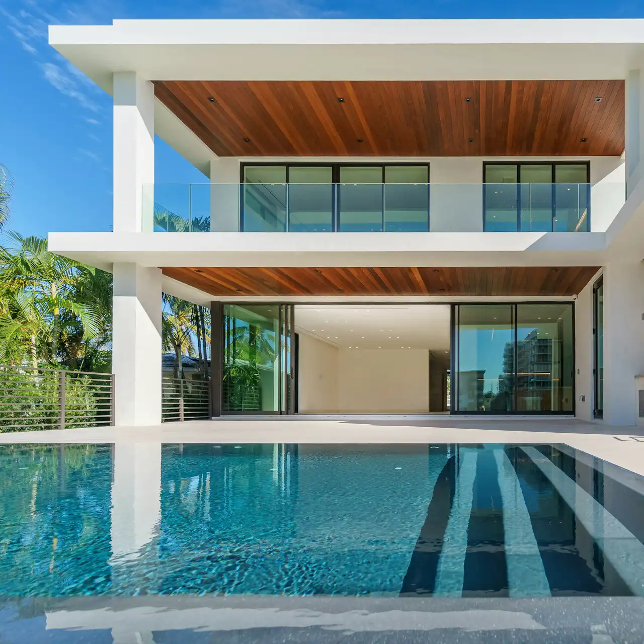 Outdoor pool area with sun loungers and relaxing seating space
