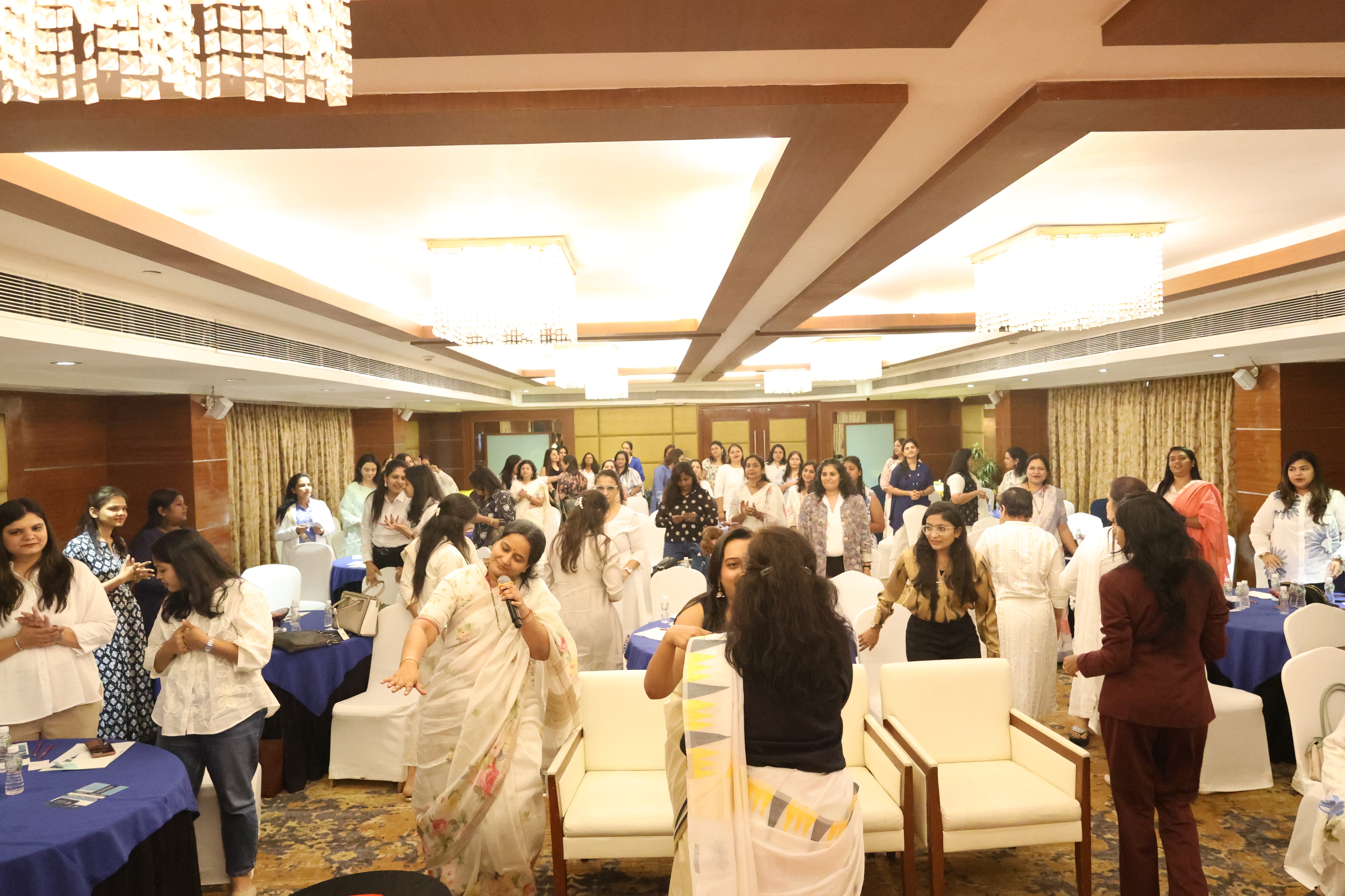 A Man Talking using Microphone in the Conference Room