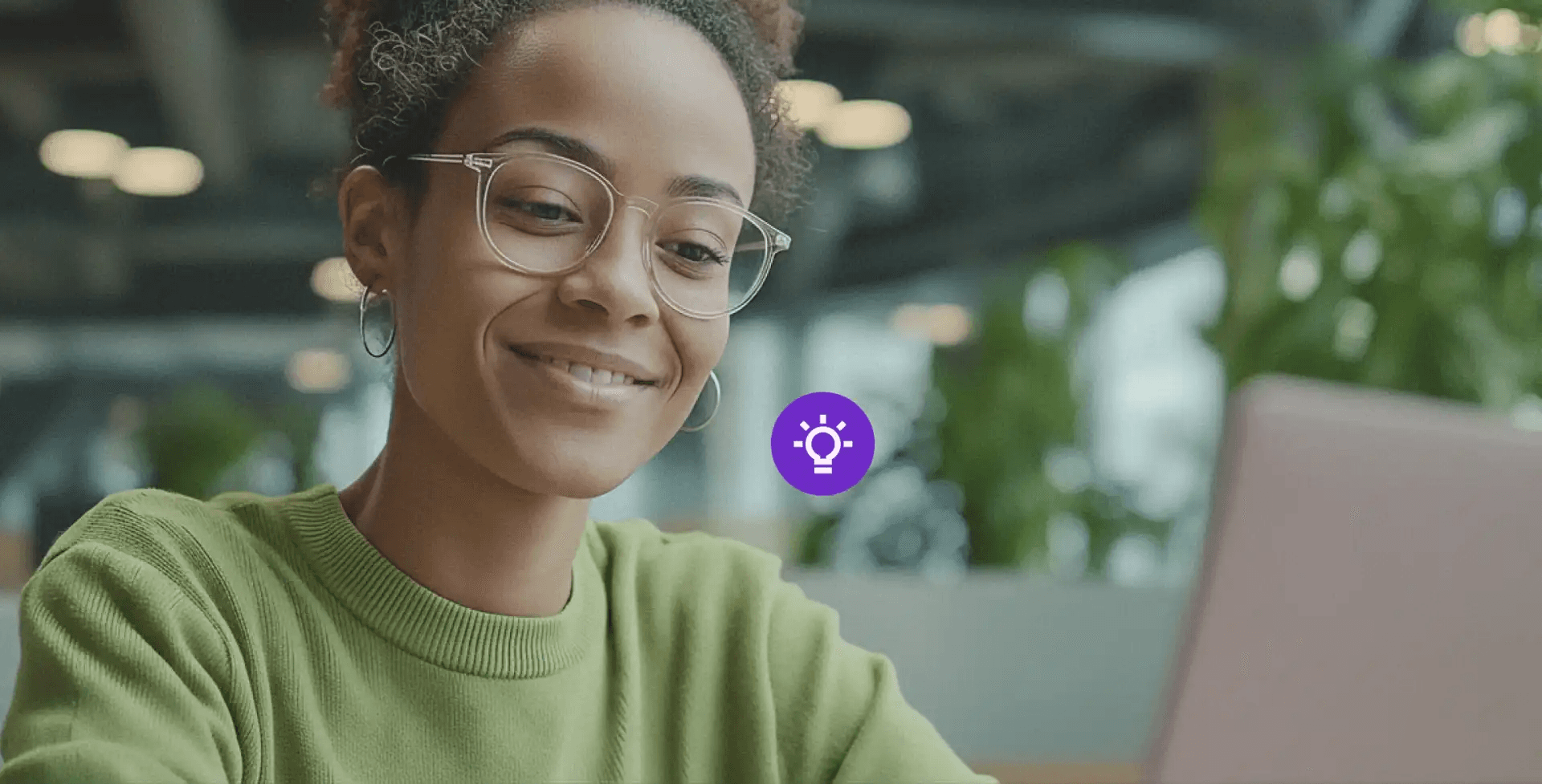 Woman looking at a laptop - AI Customer Experience Examples