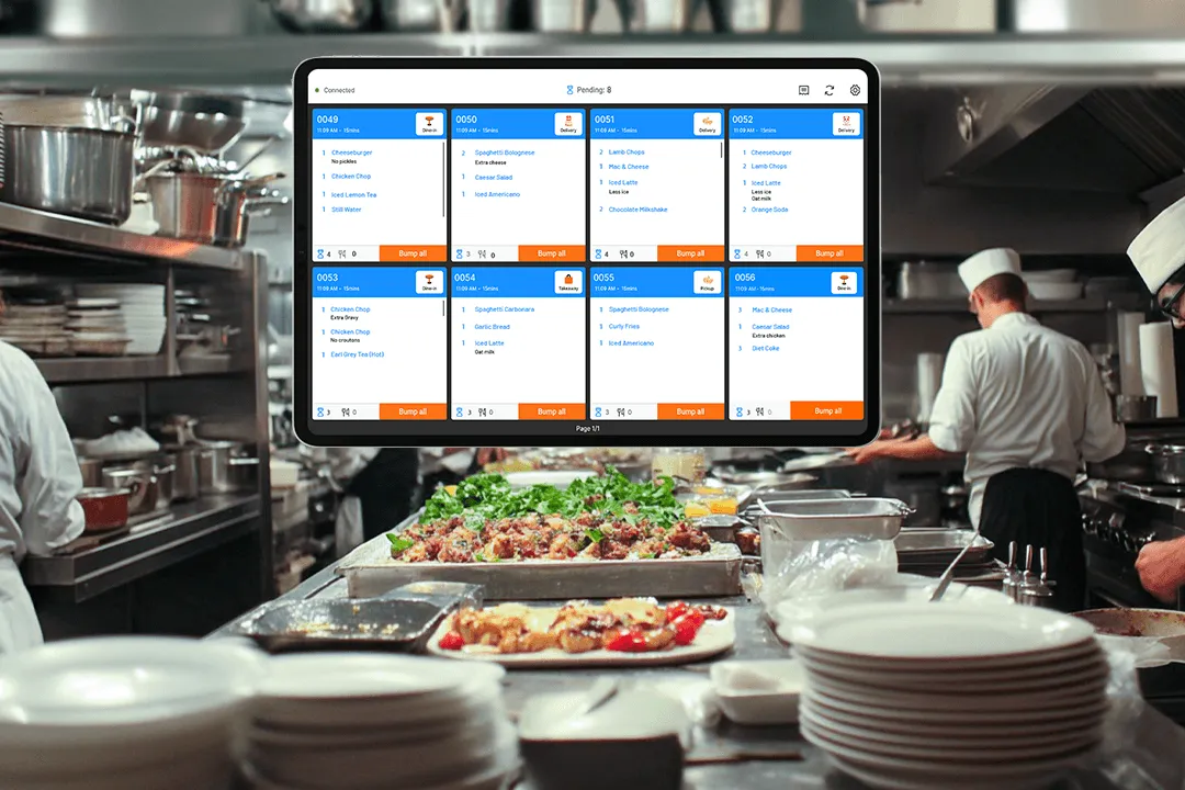 StoreHub KDS tablet displaying food orders in a restaurant kitchen.