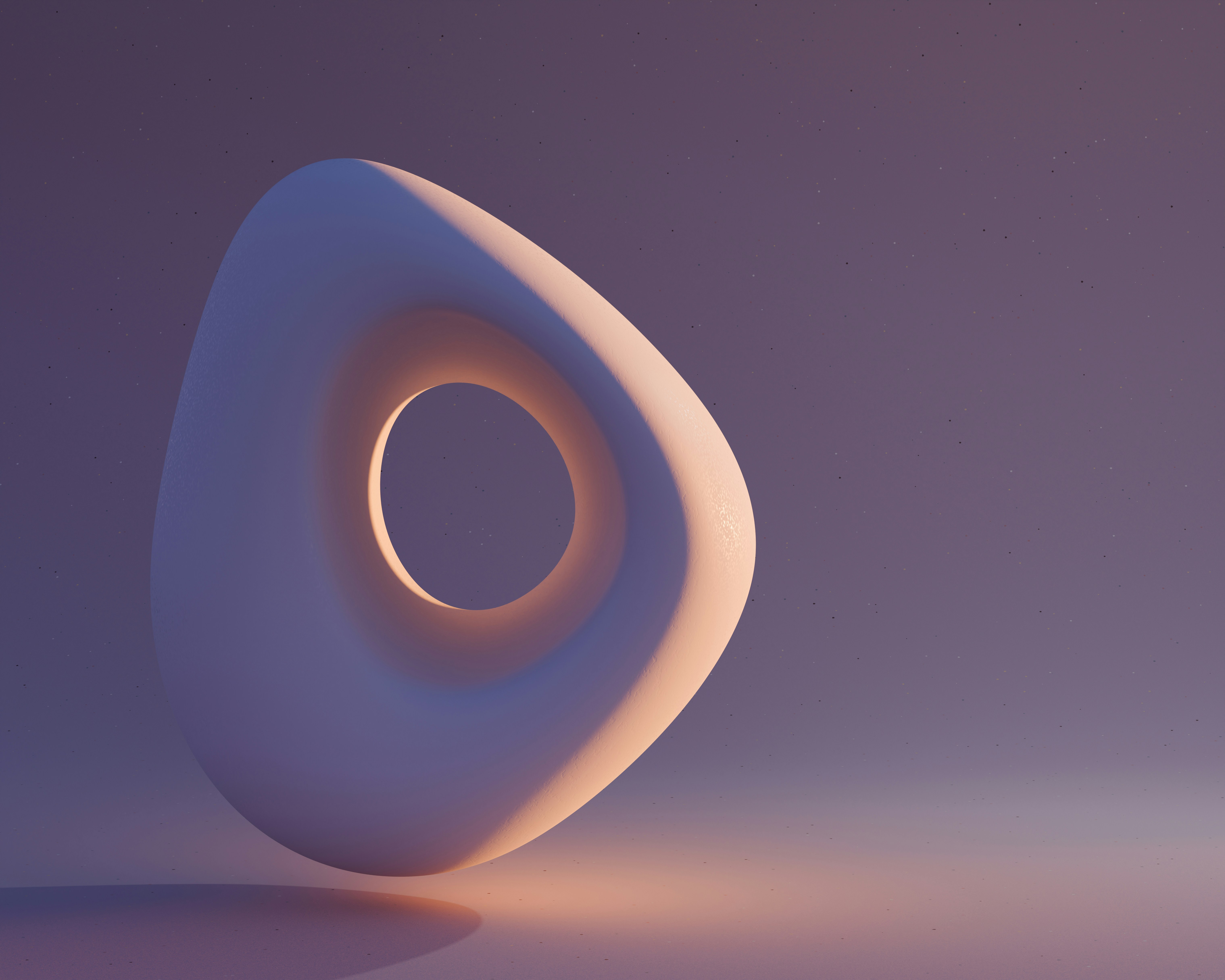 Abstract white shape with a hole in the middle.