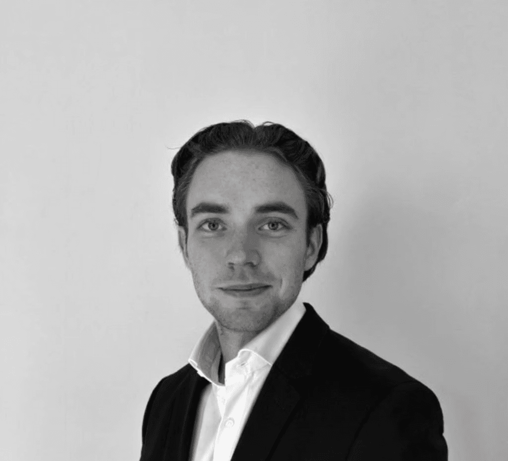 woman staring directly at camera near pink wall