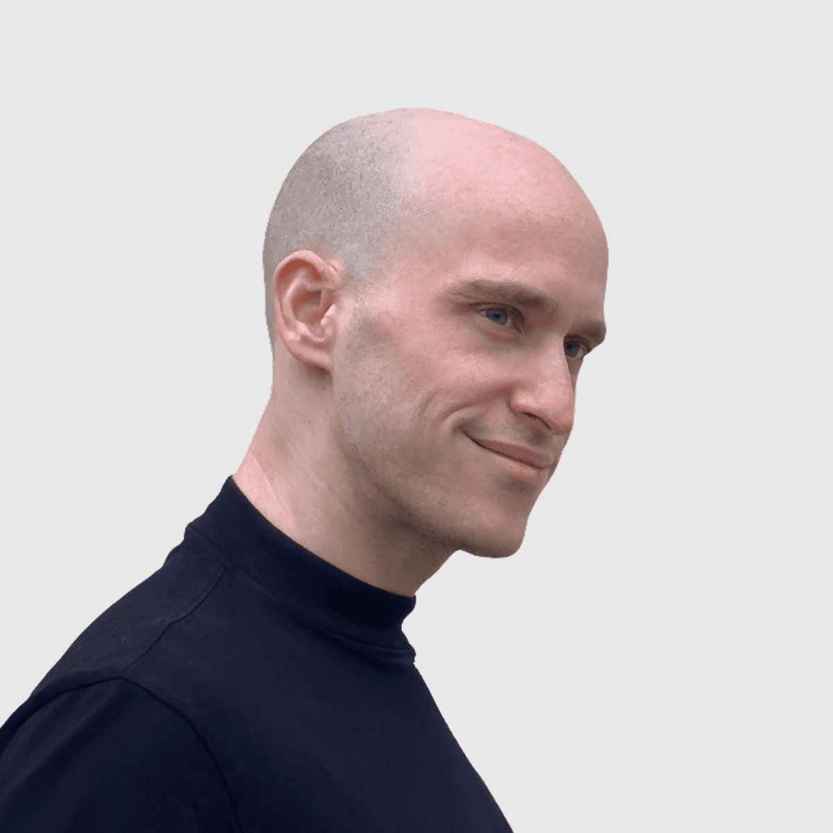 Circular portrait of a UX/UI designer wearing a black t-shirt against a light background.