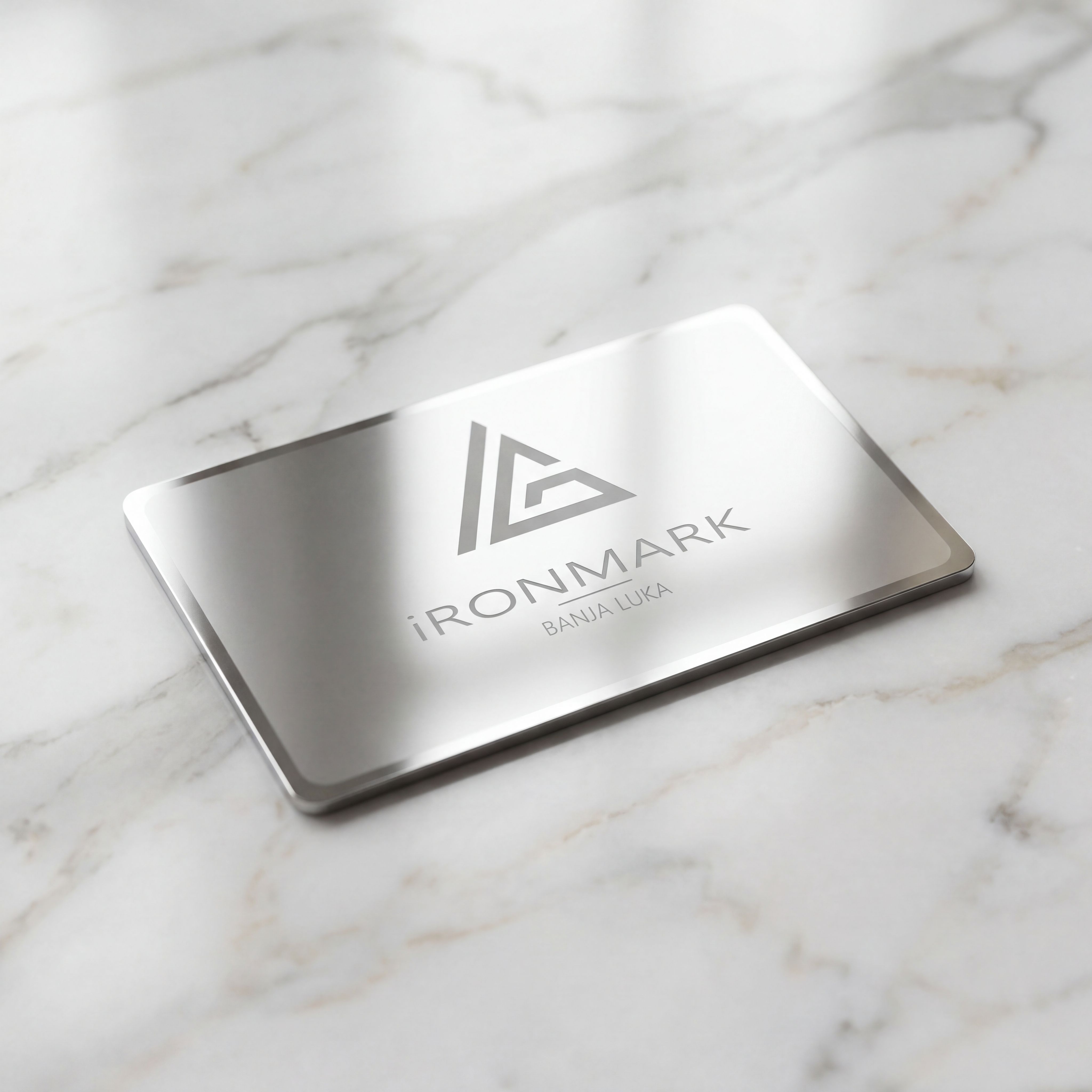 A dark glass bottle with a pump sits on a stone, surrounded by green leaves and textured background.