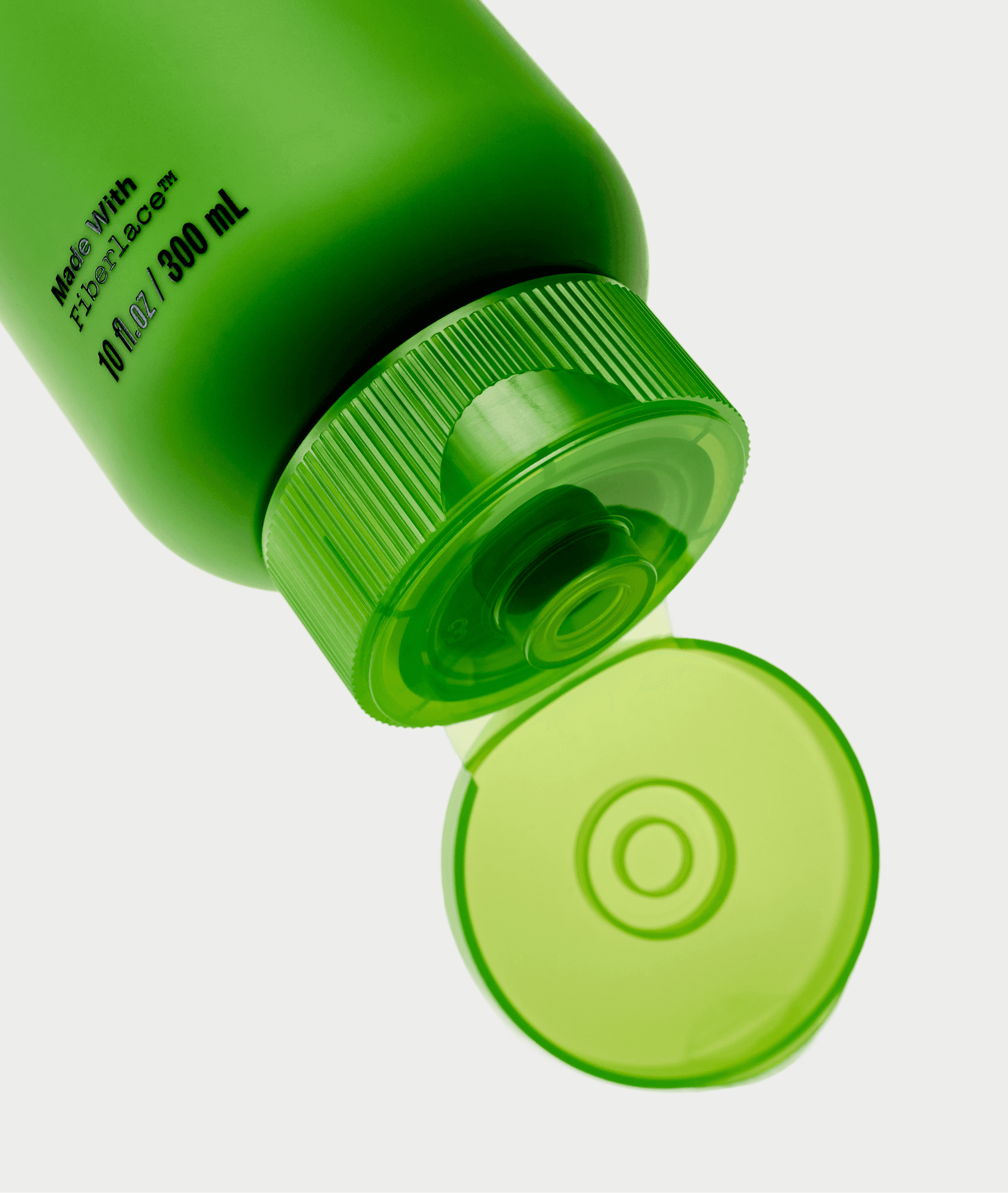 Grow-Good Beauty packaging detail — green bottle base with flip cap closure
