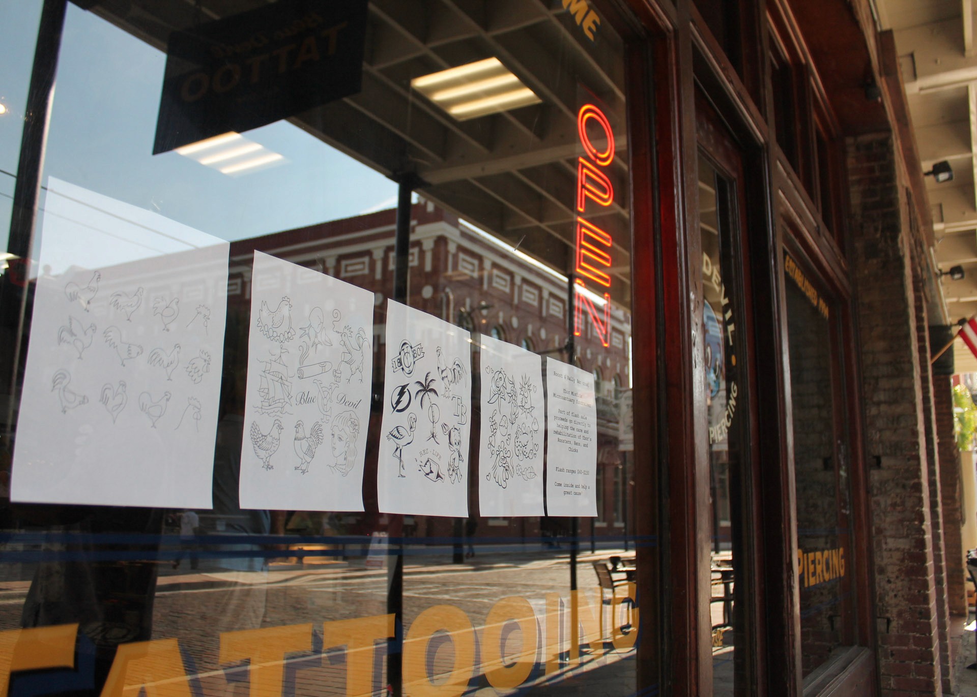 Signs at tattoo window