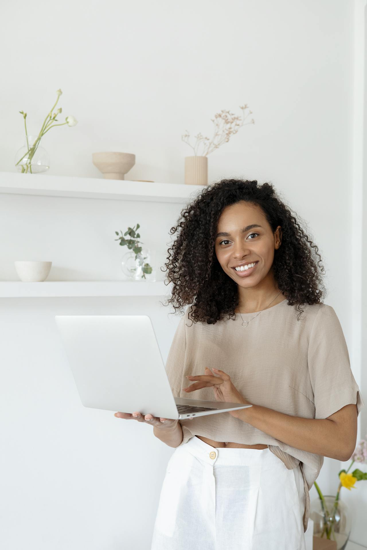 Smiling Woman Carrying Laptop
