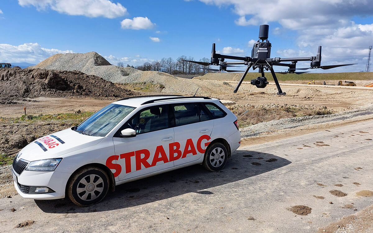 STRABAG drone checking the site and a STRABAG car