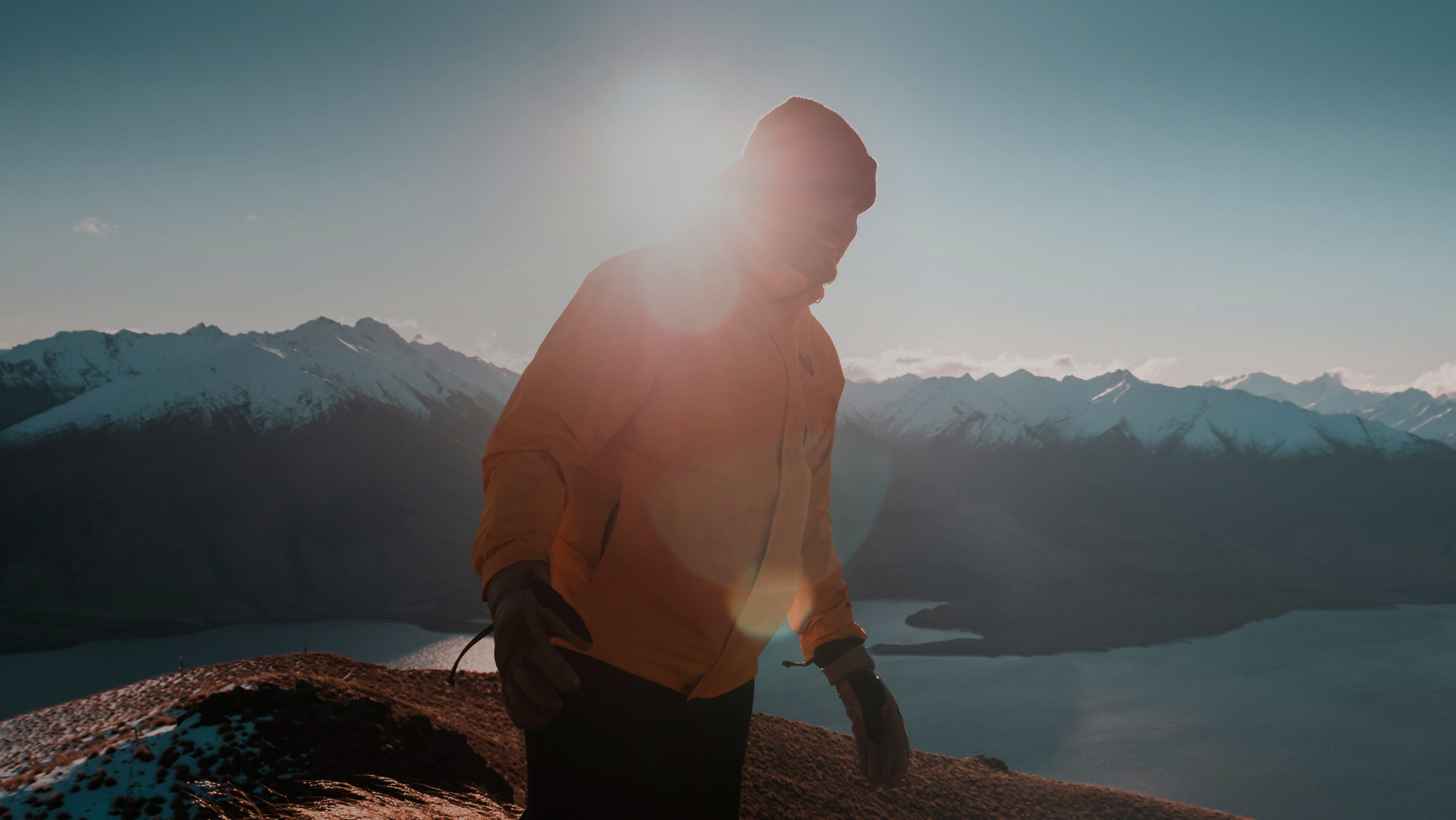 A girl walks to a cabin in nature.