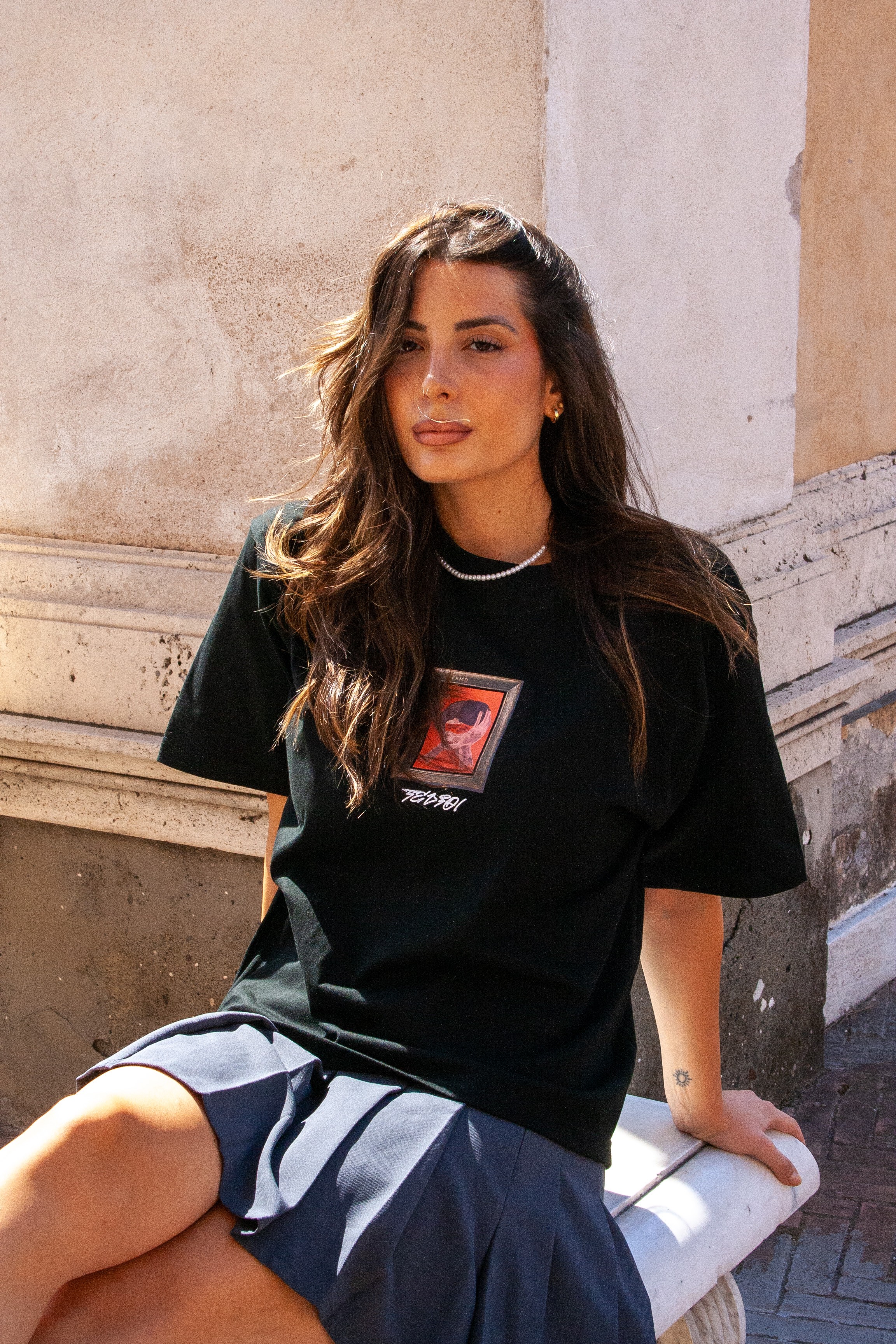 Man holding a mirror in a field.