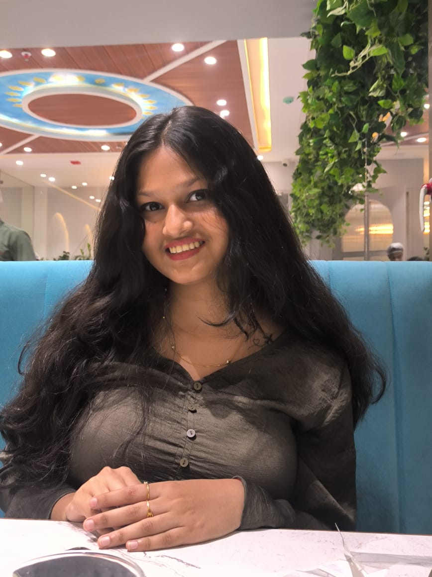 A young girl smiling