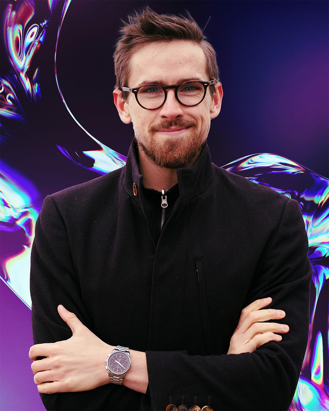 Portrait of a woman with long, smooth hair swept to the side, in a dark t-shirt, on a plain background.