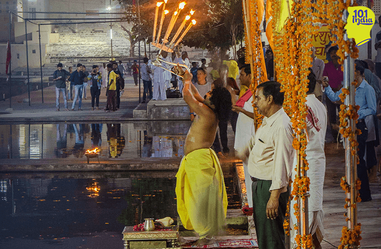 Priest offering aarti at the Pushkar lake