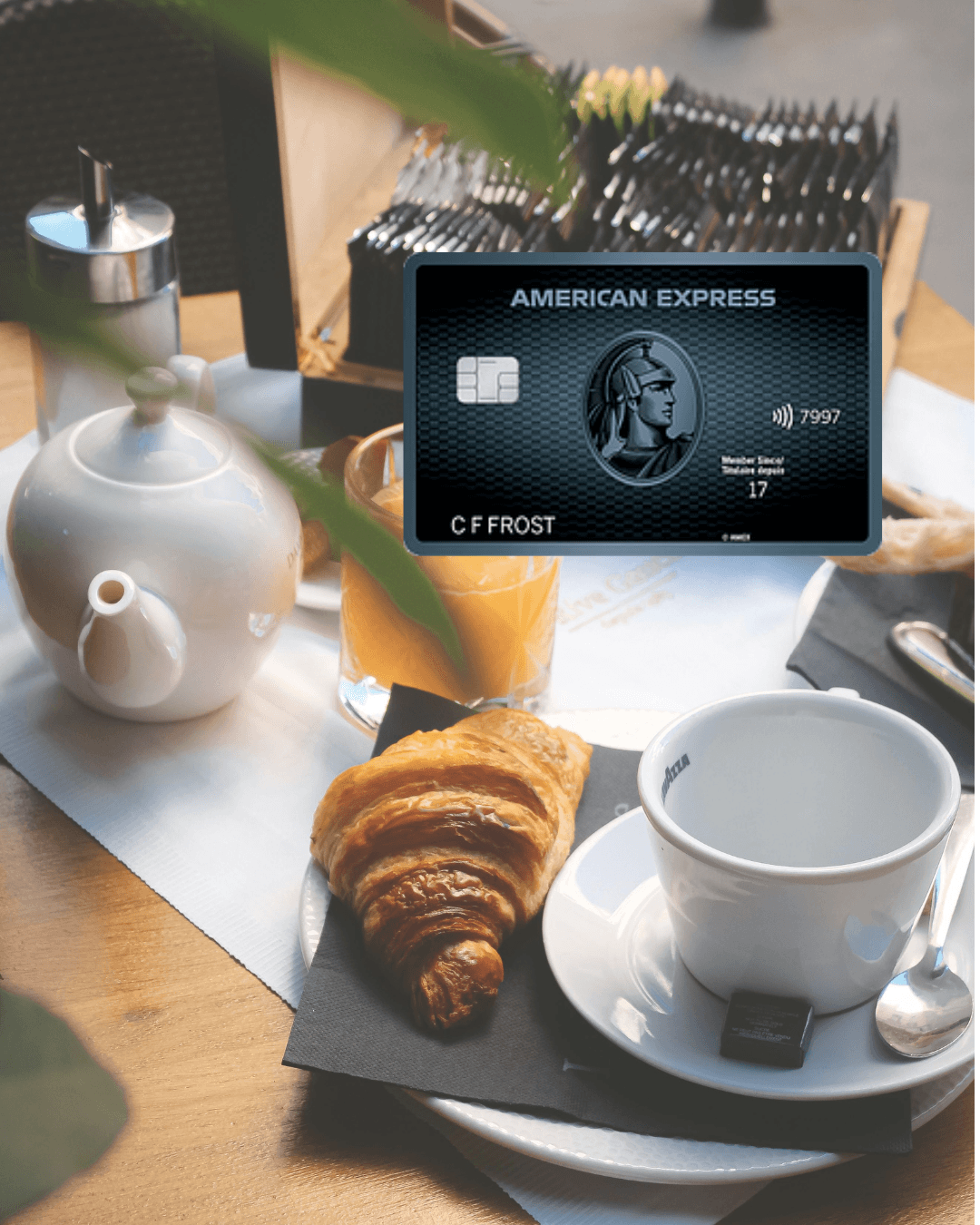 The American Express Cobalt Card floating above a cafe breakfast table with a croissant and coffee, highlighting the 5x points earned on food and dining in Canada.