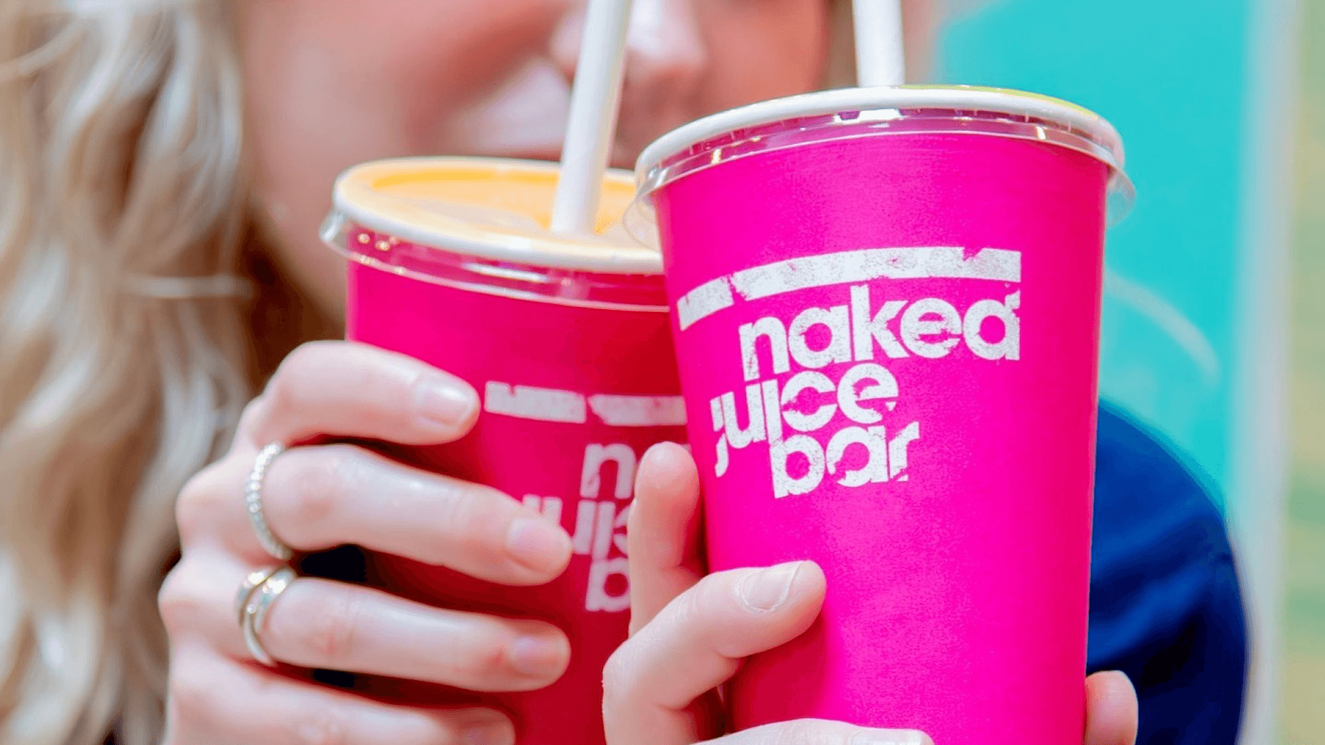 Picture of 2 women getting a juice at the naked juice bar